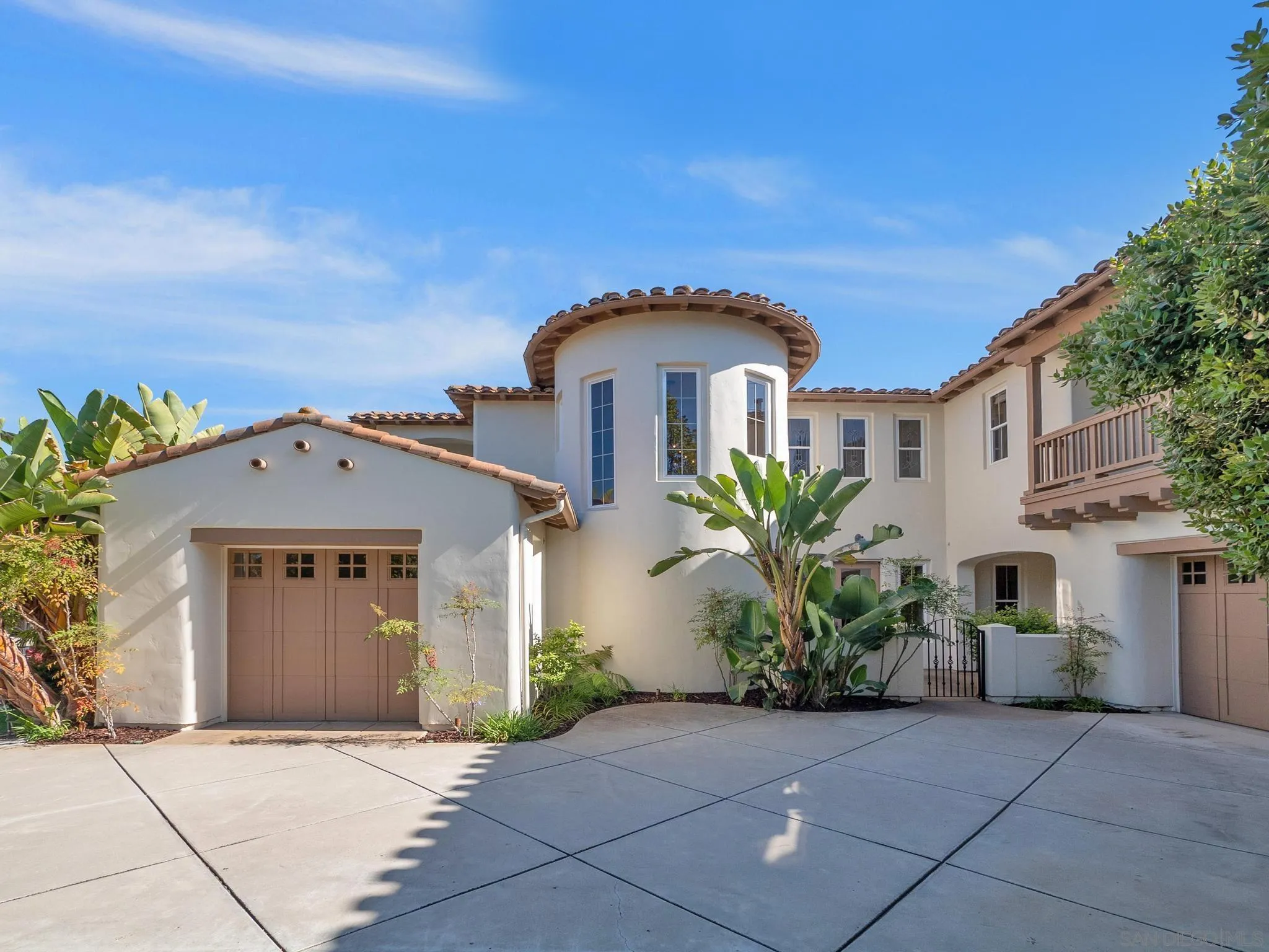 14636 Rio Rancho San Diego, CA 92127 - Photo 3 of 61 a front view of a house with a garden