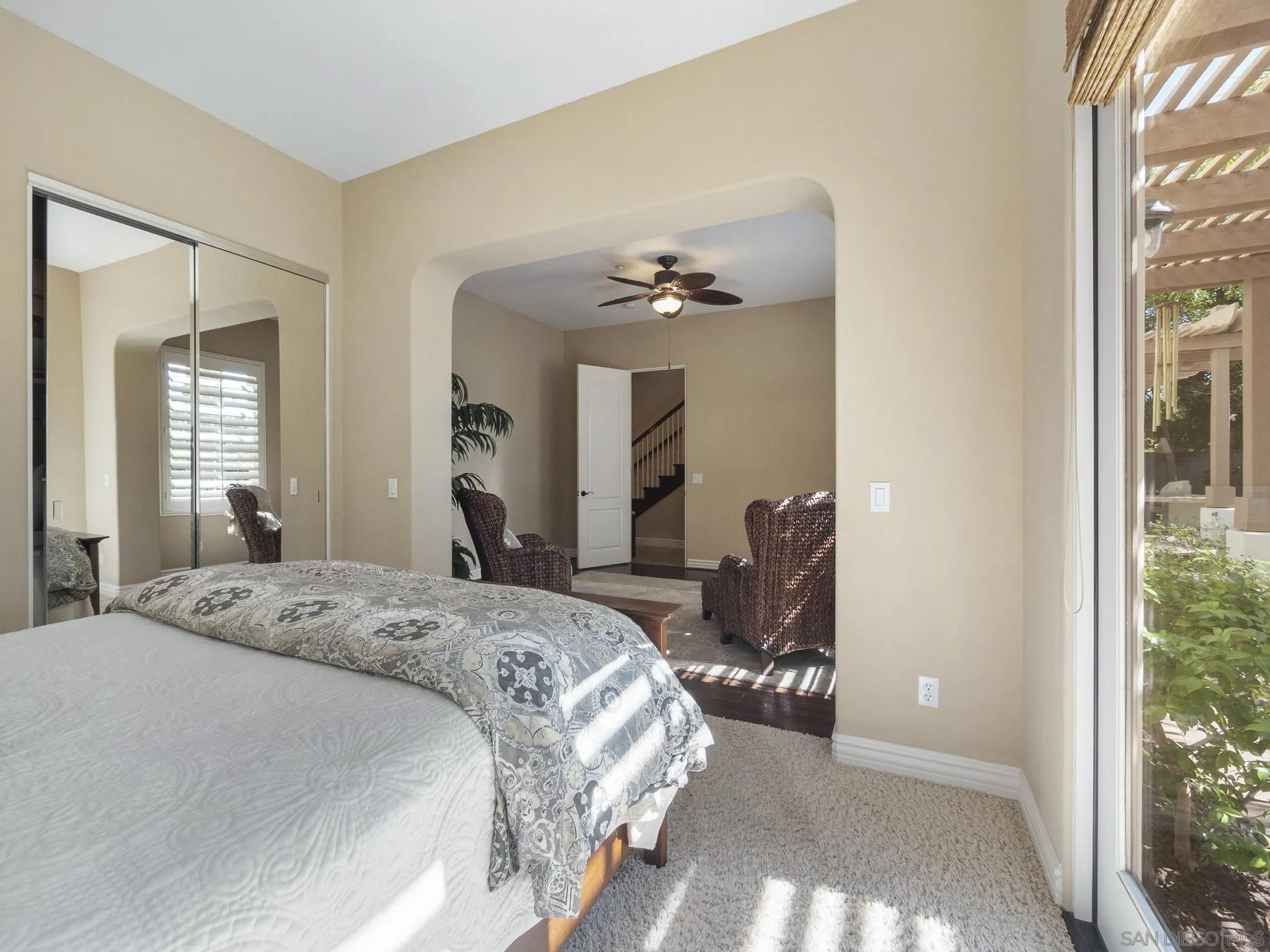 14636 Rio Rancho San Diego, CA 92127 - Photo 31 of 61 a bedroom with a bed and a large mirror on dresser