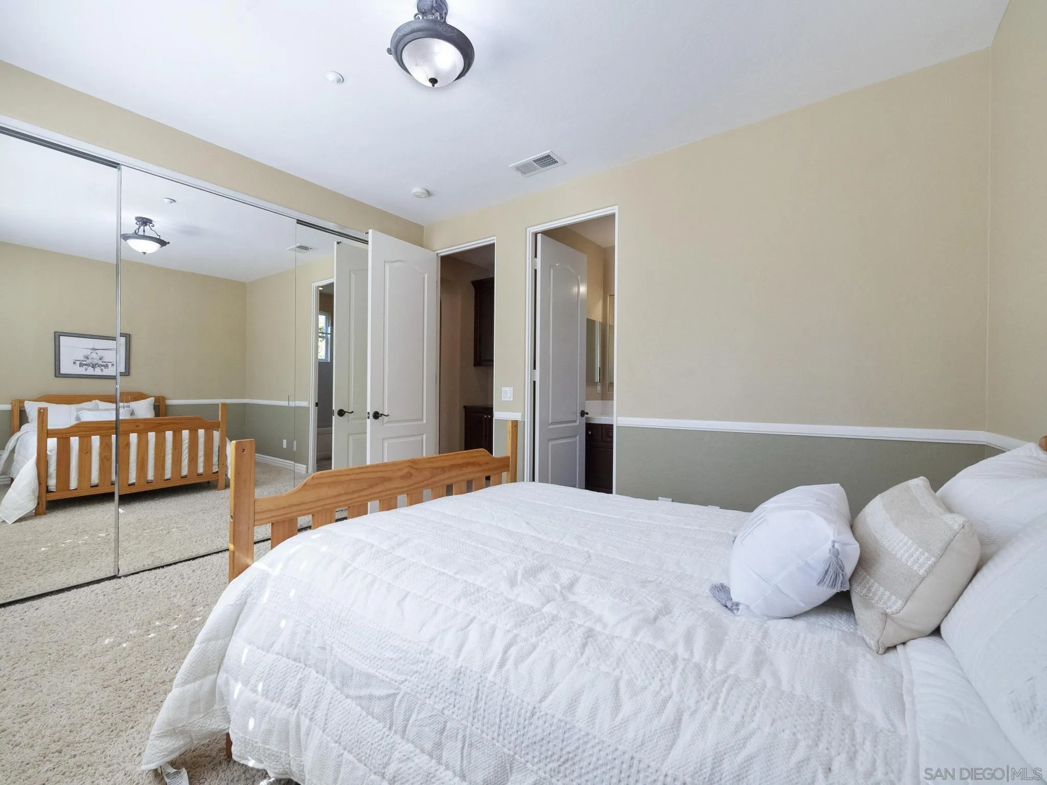 14636 Rio Rancho San Diego, CA 92127 - Photo 36 of 61 a bedroom with a bed and a night stand