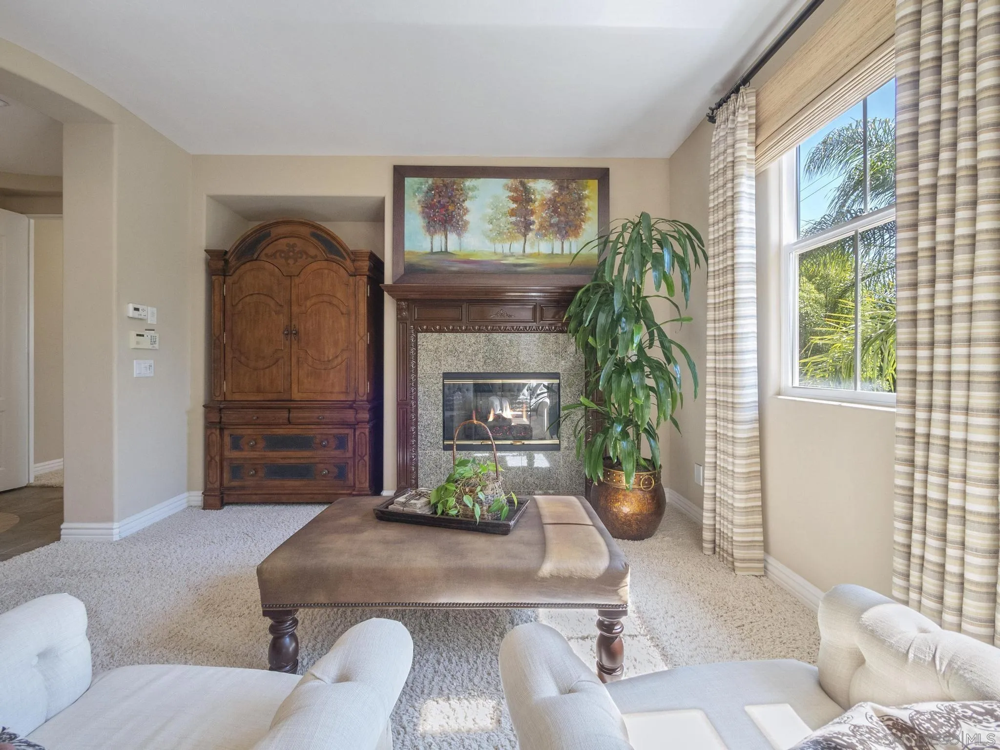 14636 Rio Rancho San Diego, CA 92127 - Photo 40 of 61 a living room with furniture and a fireplace