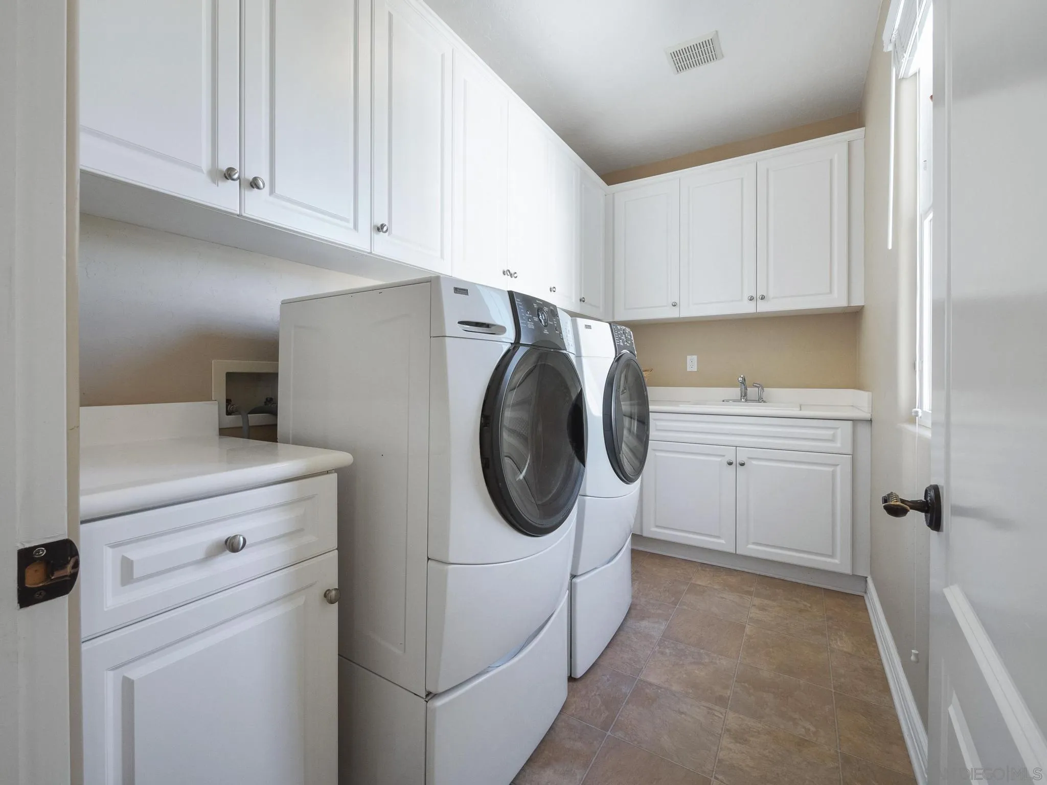 14636 Rio Rancho San Diego, CA 92127 - Photo 53 of 61 a utility room with sink dryer and washer