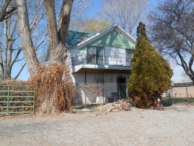 a house with trees in front of it