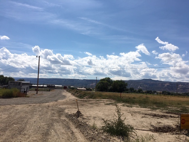 1966 J Road Fruita, CO 81521 - Photo 11 of 15 a view of a lake with a yard