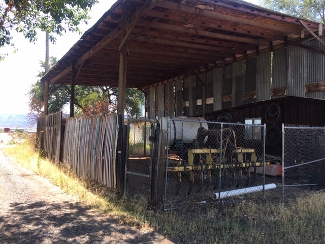 1966 J Road Fruita, CO 81521 - Photo 14 of 15 a view of patio with table and chairs under an umbrella