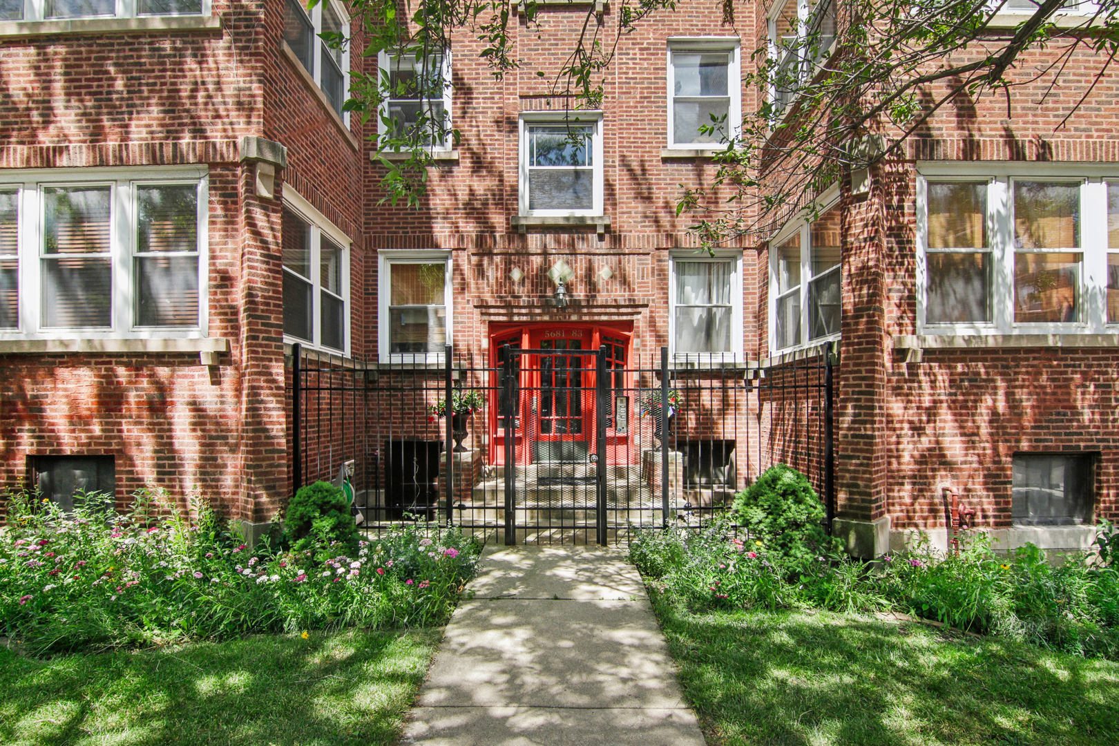5683 North Ridge Avenue, Unit 2W Chicago, IL 60660 - Photo 1 of 23 front view of a brick building