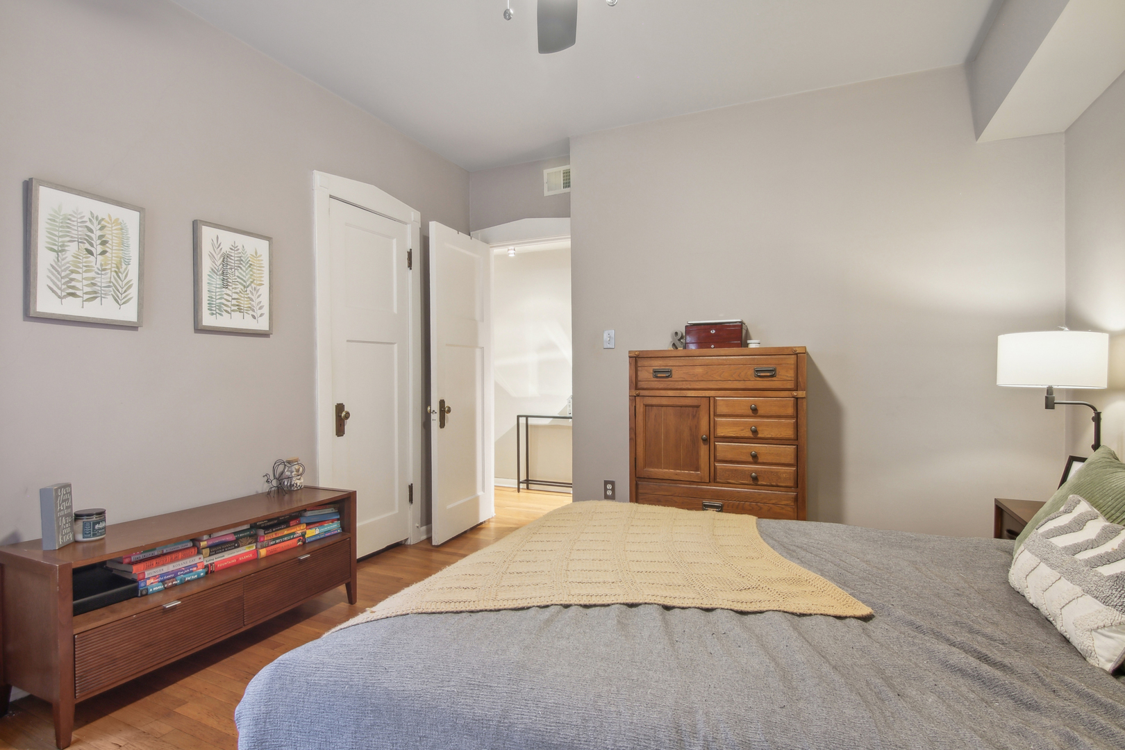 5683 North Ridge Avenue, Unit 2W Chicago, IL 60660 - Photo 16 of 23 a bedroom with a bed and a dresser