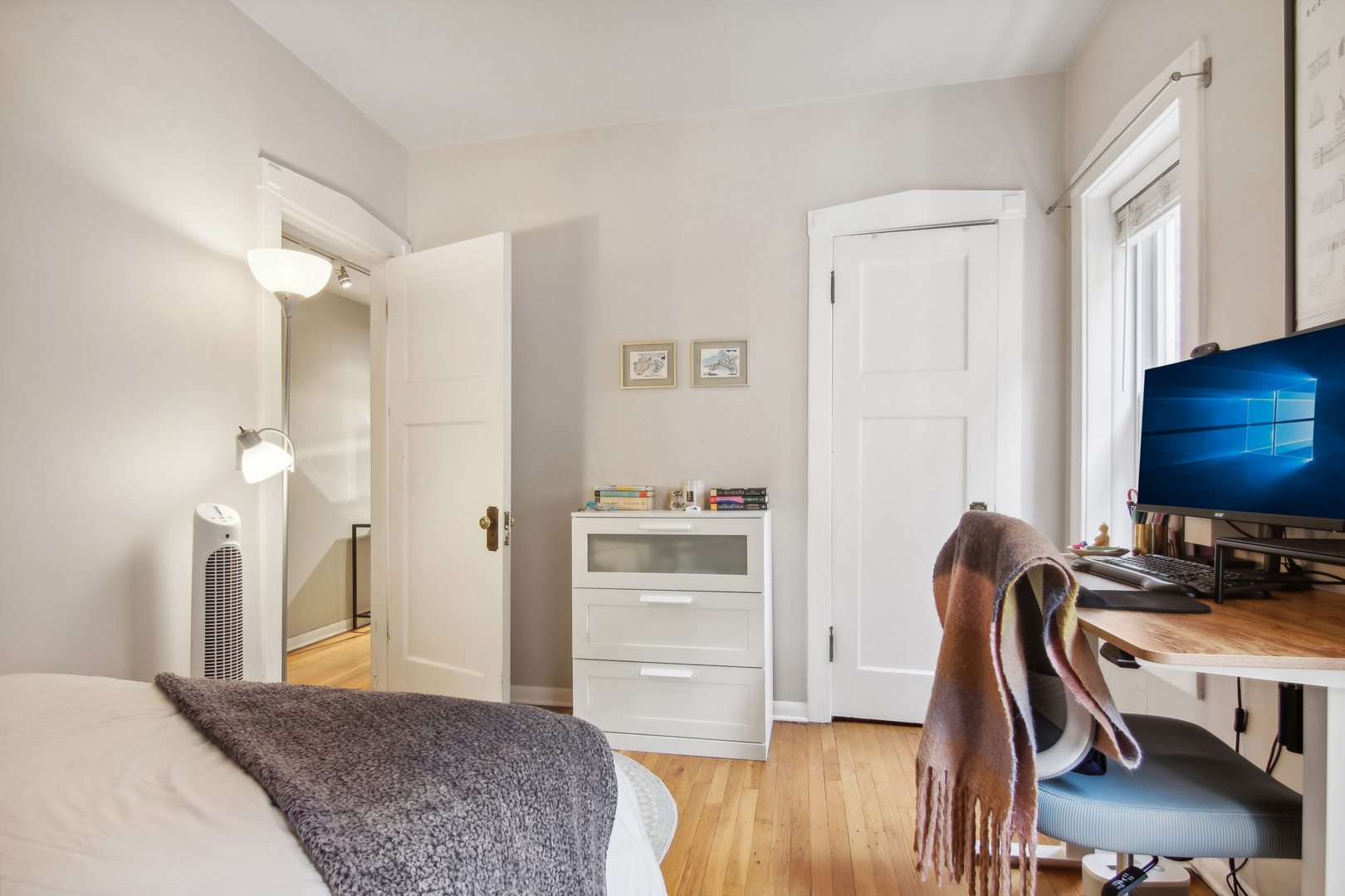 5683 North Ridge Avenue, Unit 2W Chicago, IL 60660 - Photo 20 of 23 a bedroom with a bed and furniture