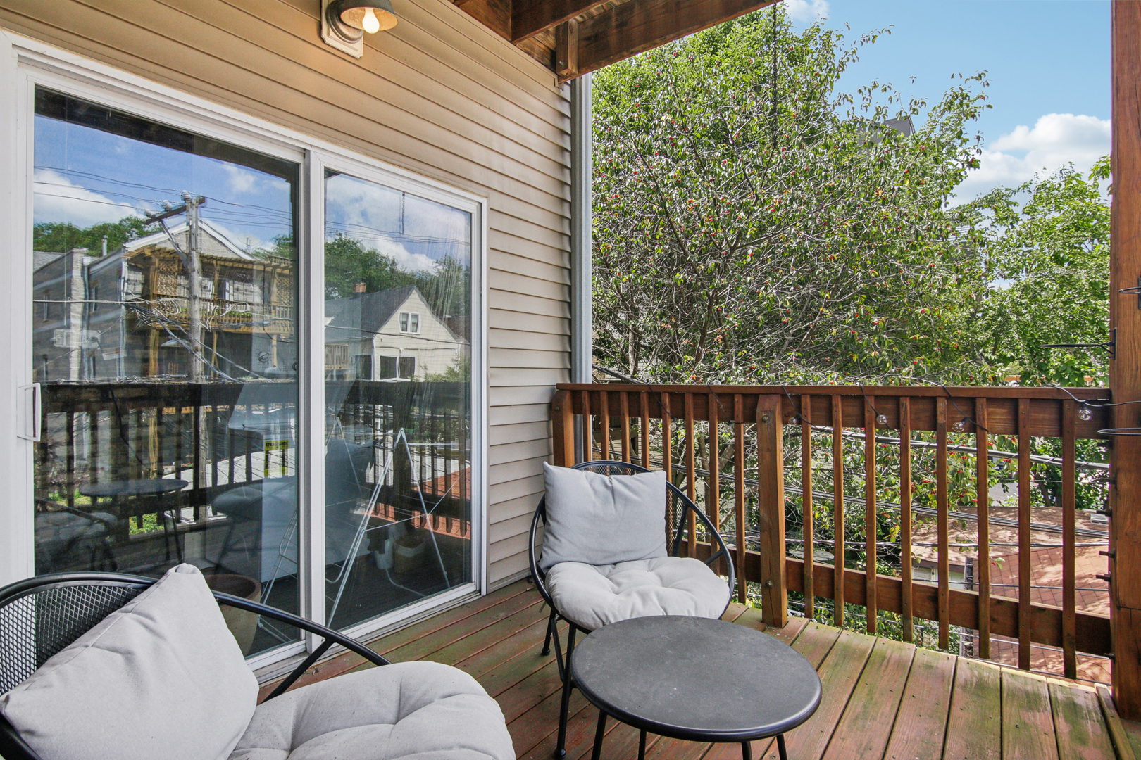 5683 North Ridge Avenue, Unit 2W Chicago, IL 60660 - Photo 21 of 23 a balcony with table and chairs