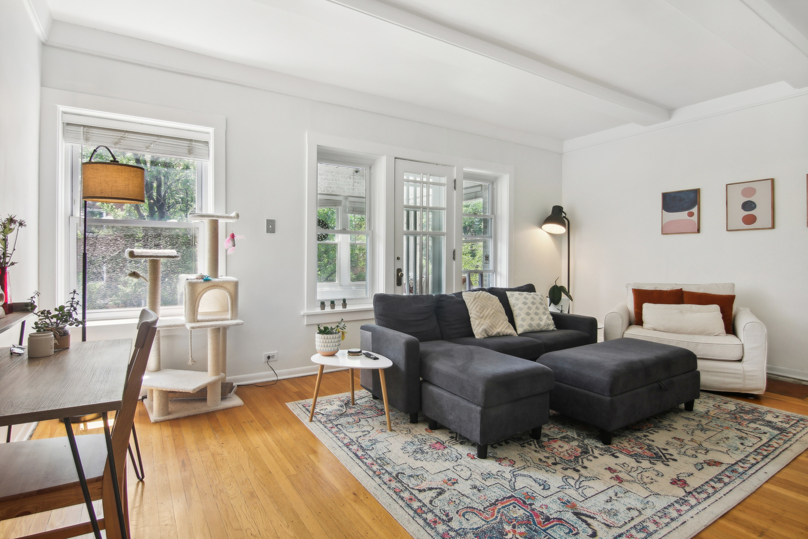 5683 North Ridge Avenue, Unit 2W Chicago, IL 60660 - Photo 3 of 23 a living room with furniture and a wooden floor