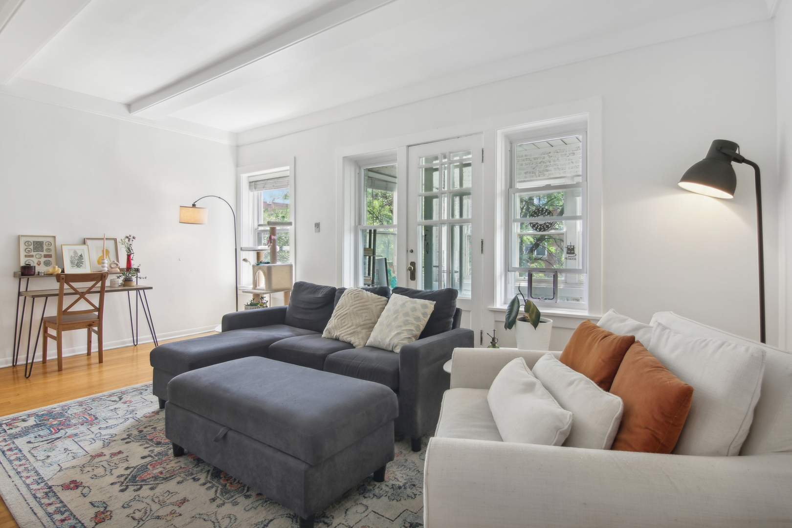 5683 North Ridge Avenue, Unit 2W Chicago, IL 60660 - Photo 4 of 23 a living room with furniture and a large window
