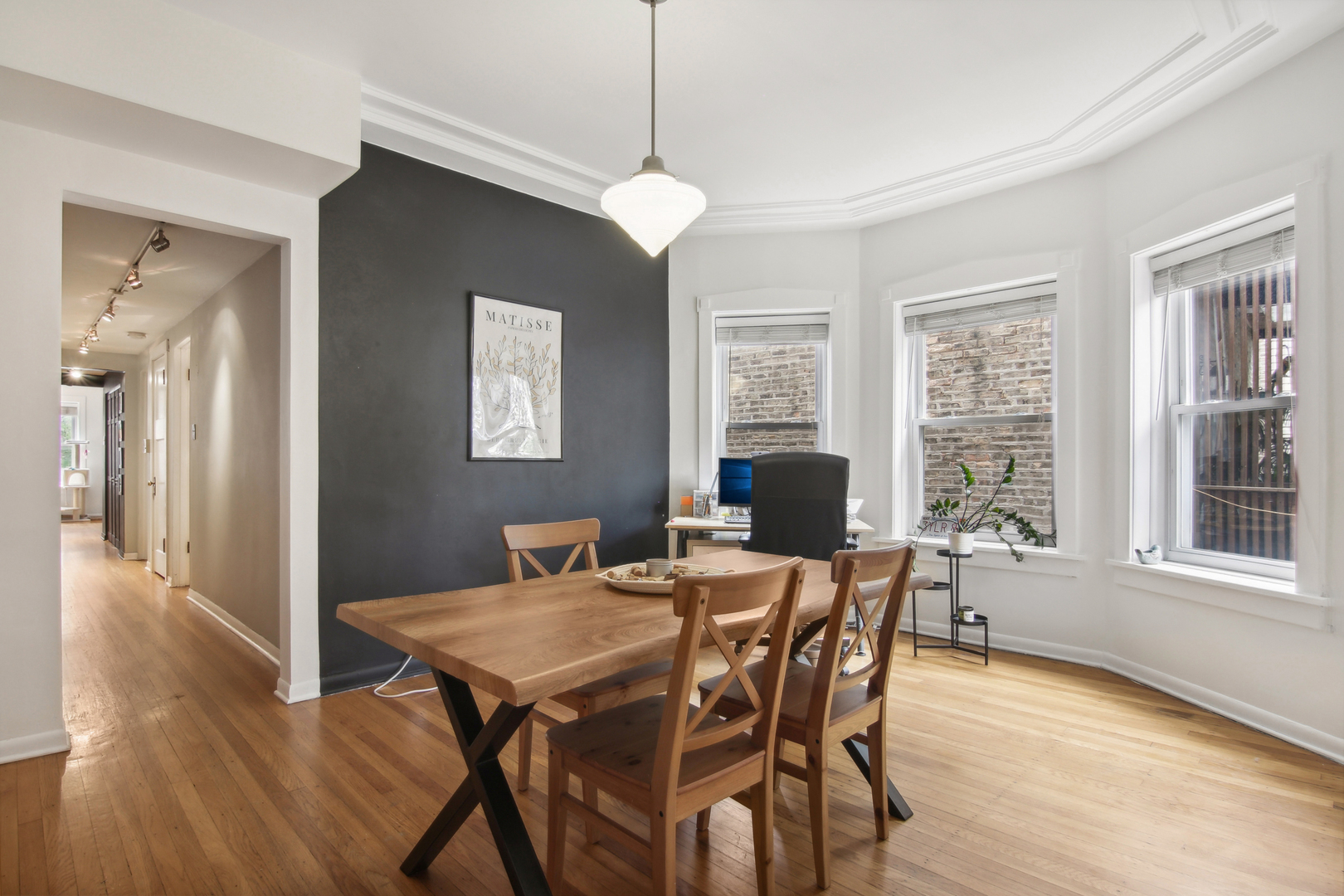 5683 North Ridge Avenue, Unit 2W Chicago, IL 60660 - Photo 8 of 23 a view of a dining room with furniture window and wooden floor