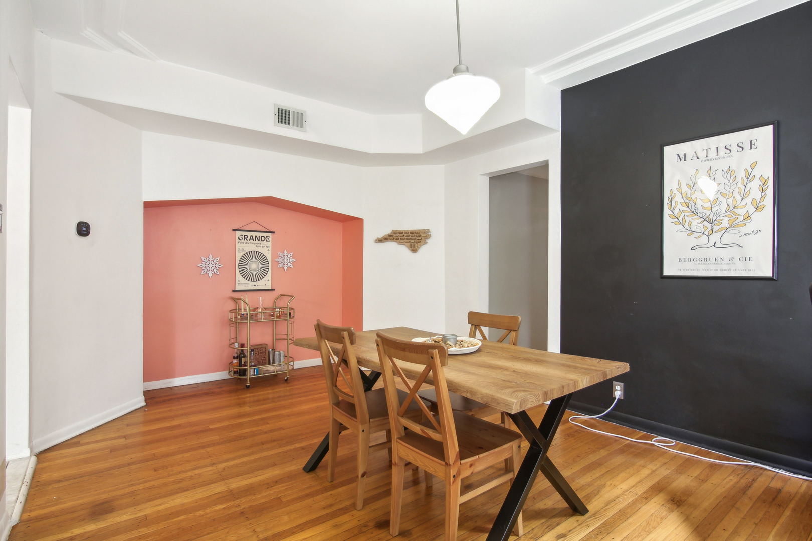 5683 North Ridge Avenue, Unit 2W Chicago, IL 60660 - Photo 9 of 23 a view of a dining room with furniture and wooden floor