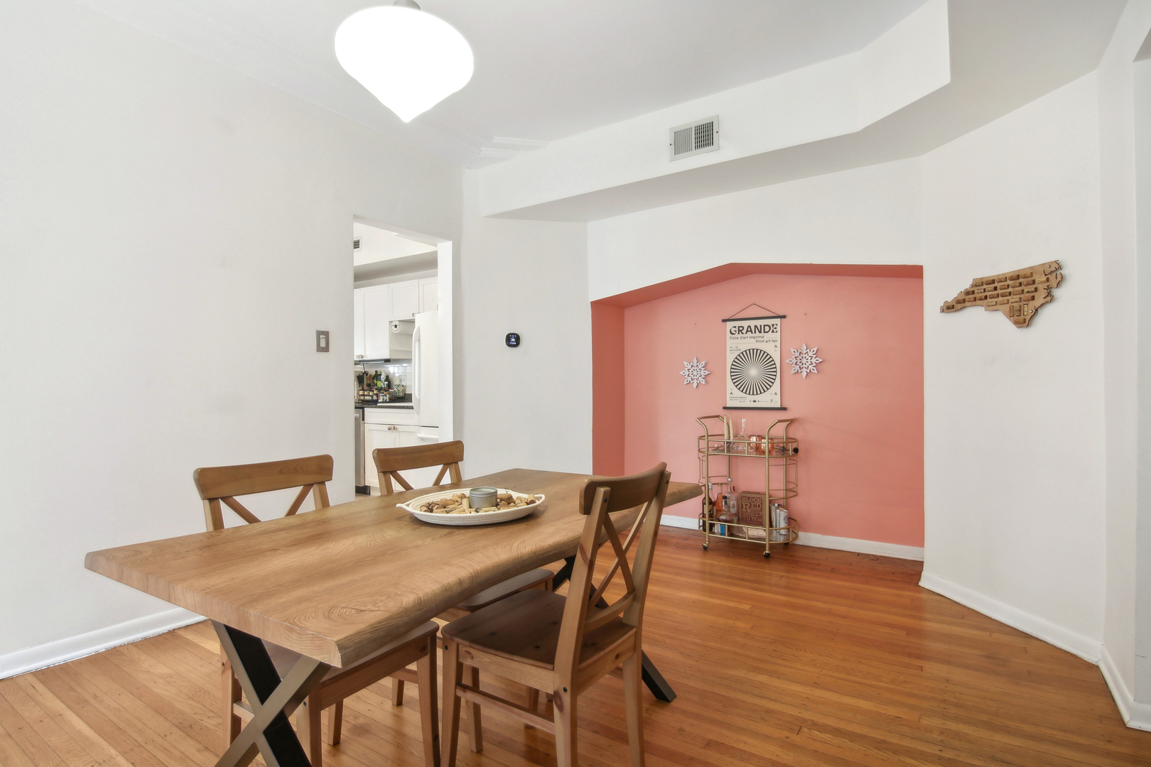 5683 North Ridge Avenue, Unit 2W Chicago, IL 60660 - Photo 10 of 23 a view of a dining room with furniture and wooden floor