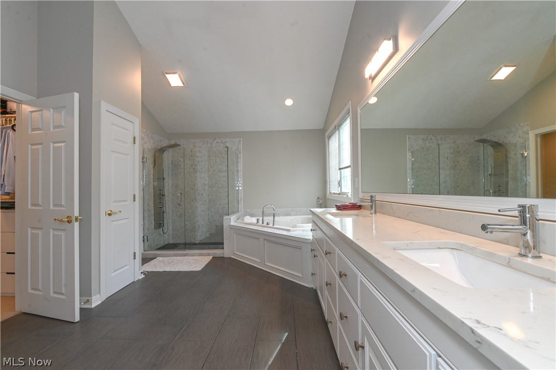 1688 Sheridan Road South Euclid, OH 44121 - Photo 20 of 48 Bathroom with lofted ceiling, independent shower and bath, and dual vanity