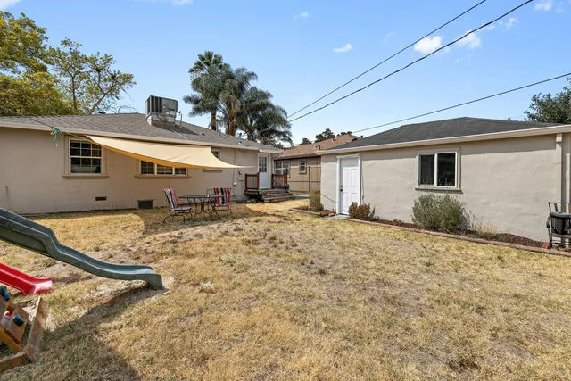a view of a house with snow on the road