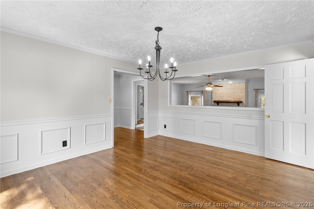 7756 Dragonhead Road Fayetteville, NC 28311 - Photo 9 of 42 a view of a chandelier in a room and kitchen