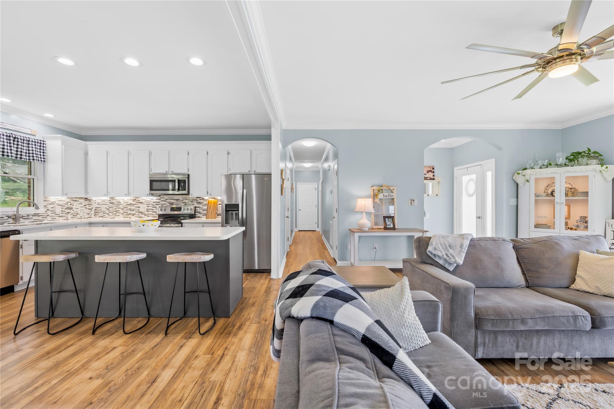 675 Normandy Road Mooresville, NC 28117 - Photo 13 of 36 a living room with furniture a couch and kitchen view