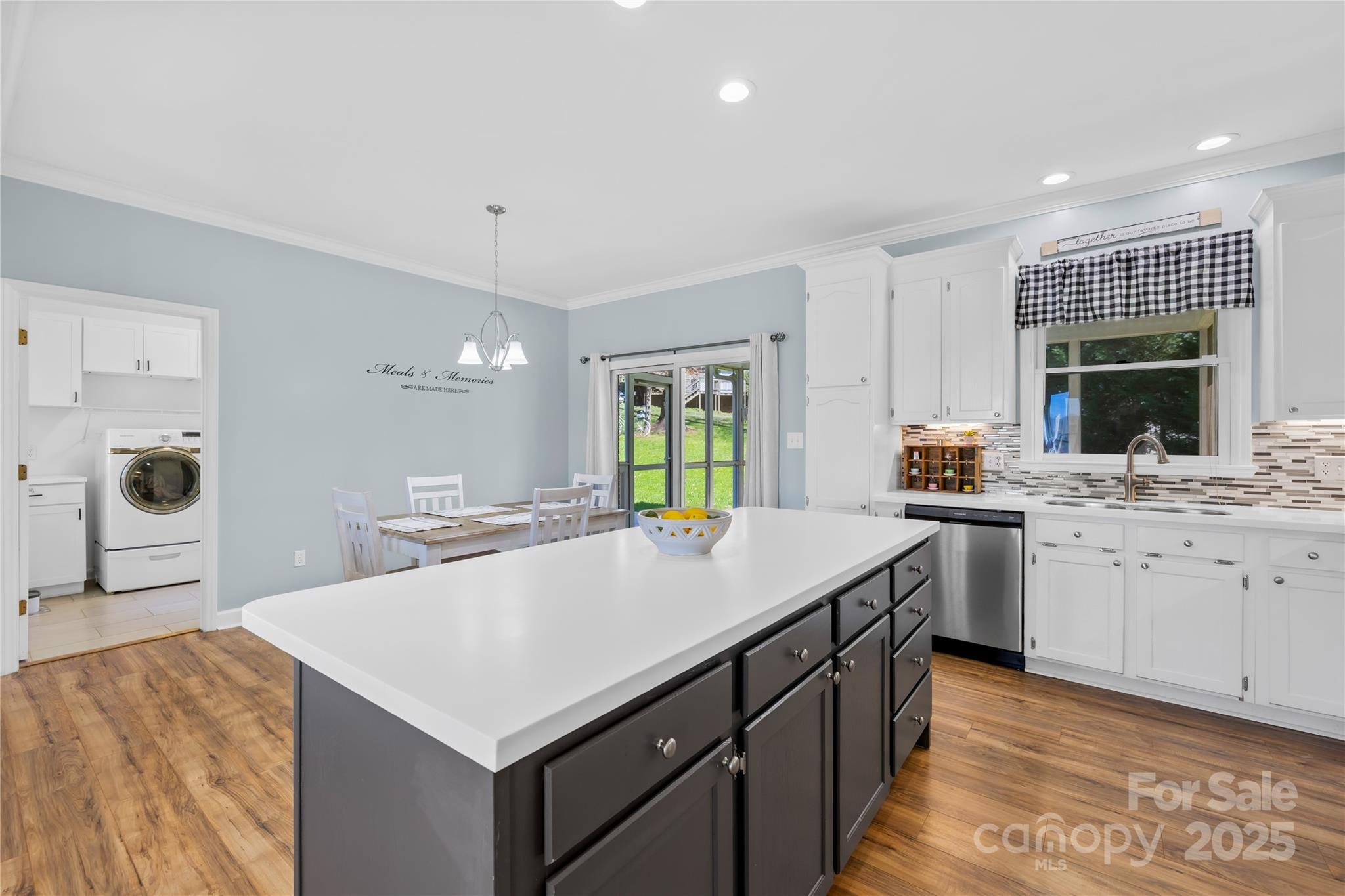 675 Normandy Road Mooresville, NC 28117 - Photo 16 of 36 a kitchen with a stove a sink and a refrigerator