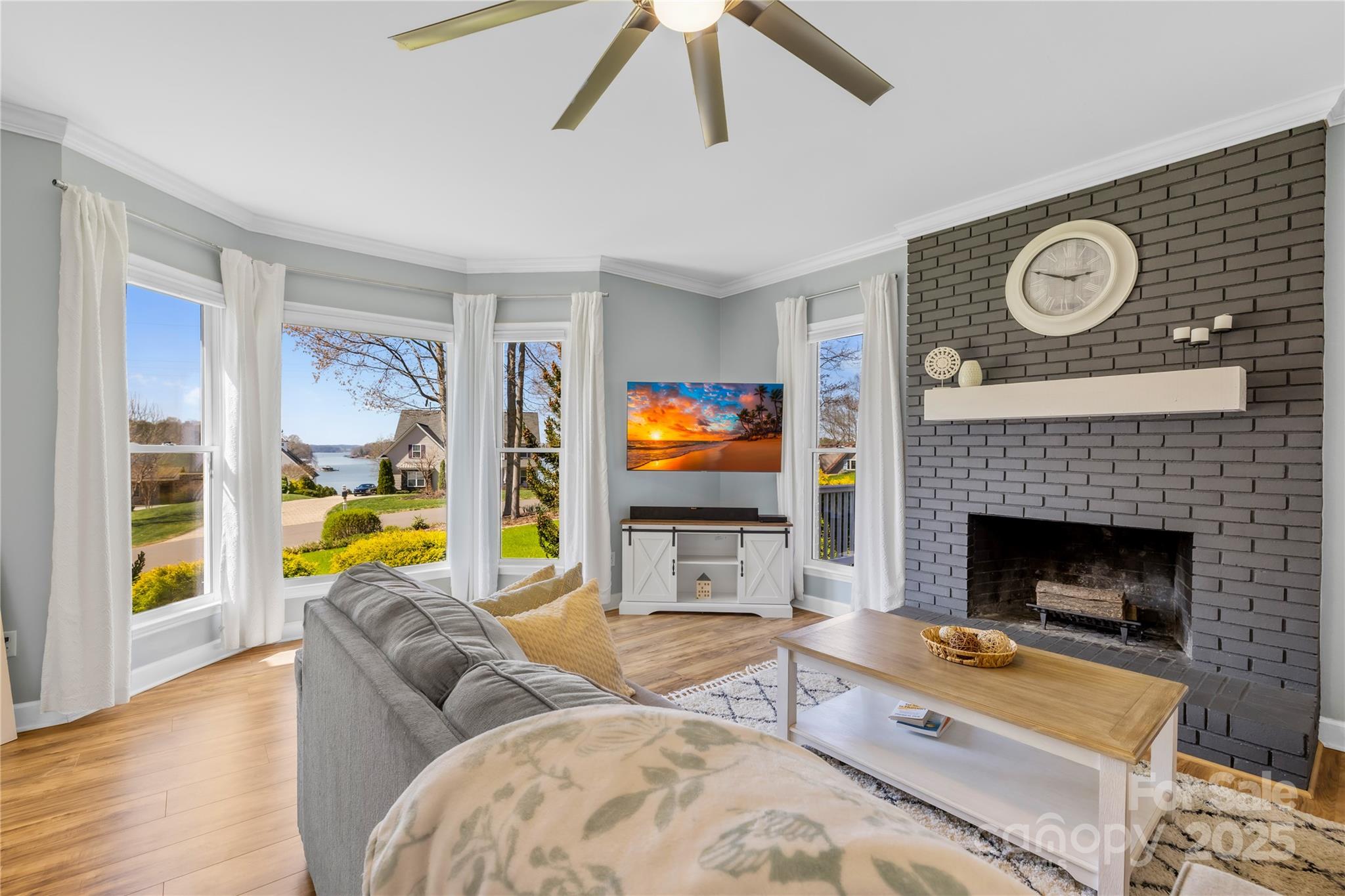 675 Normandy Road Mooresville, NC 28117 - Photo 2 of 36 a living room with furniture and a fireplace