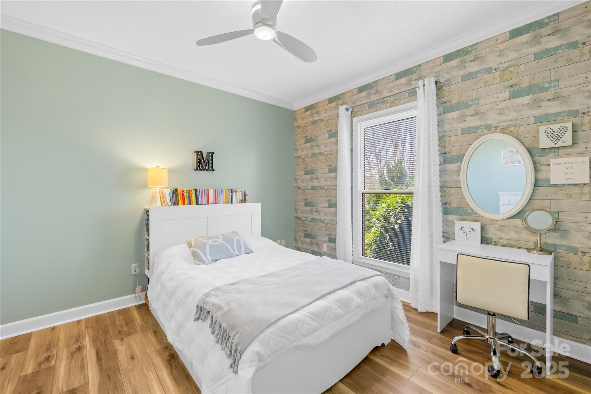 675 Normandy Road Mooresville, NC 28117 - Photo 22 of 36 a bedroom with a bed a mirror and a table in it