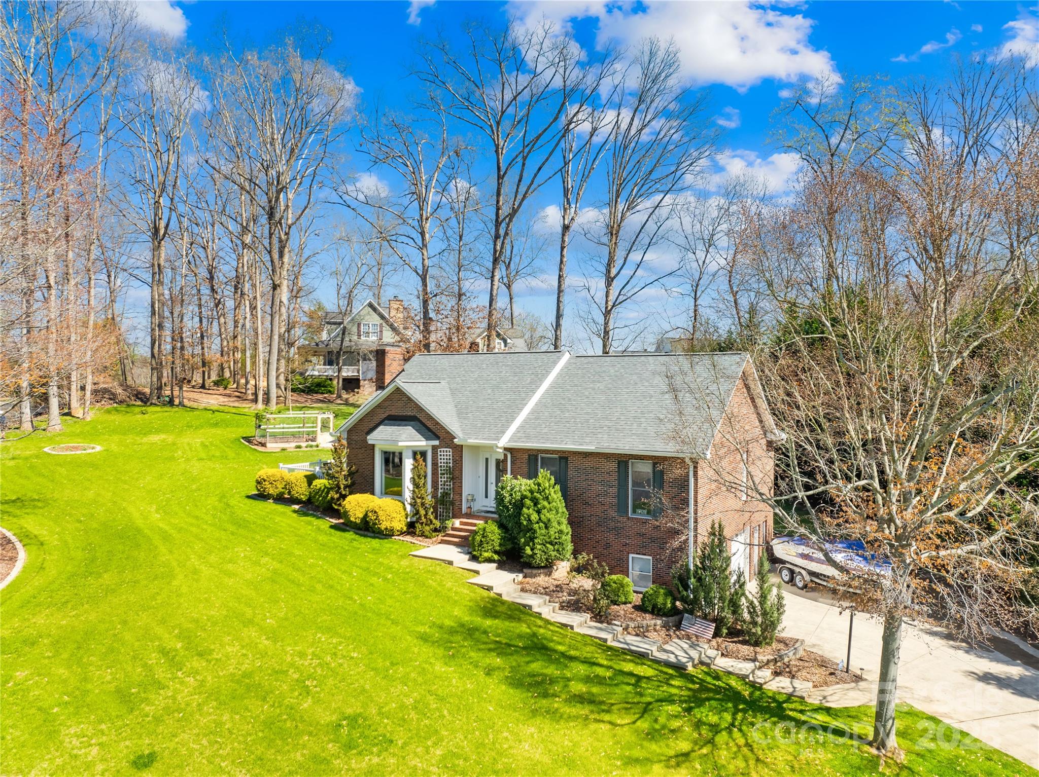 675 Normandy Road Mooresville, NC 28117 - Photo 5 of 36 a front view of a house with yard and green space