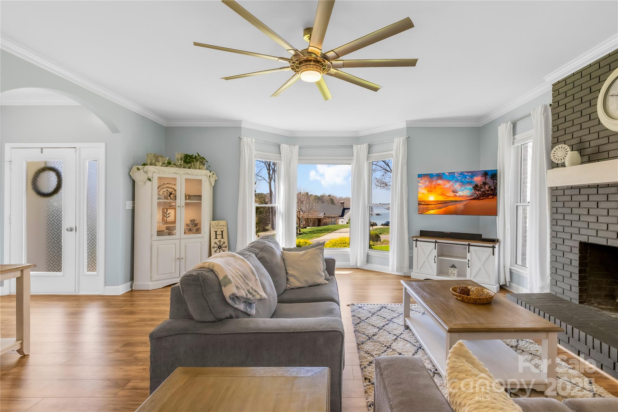 675 Normandy Road Mooresville, NC 28117 - Photo 9 of 36 a living room with fireplace furniture and a flat screen tv
