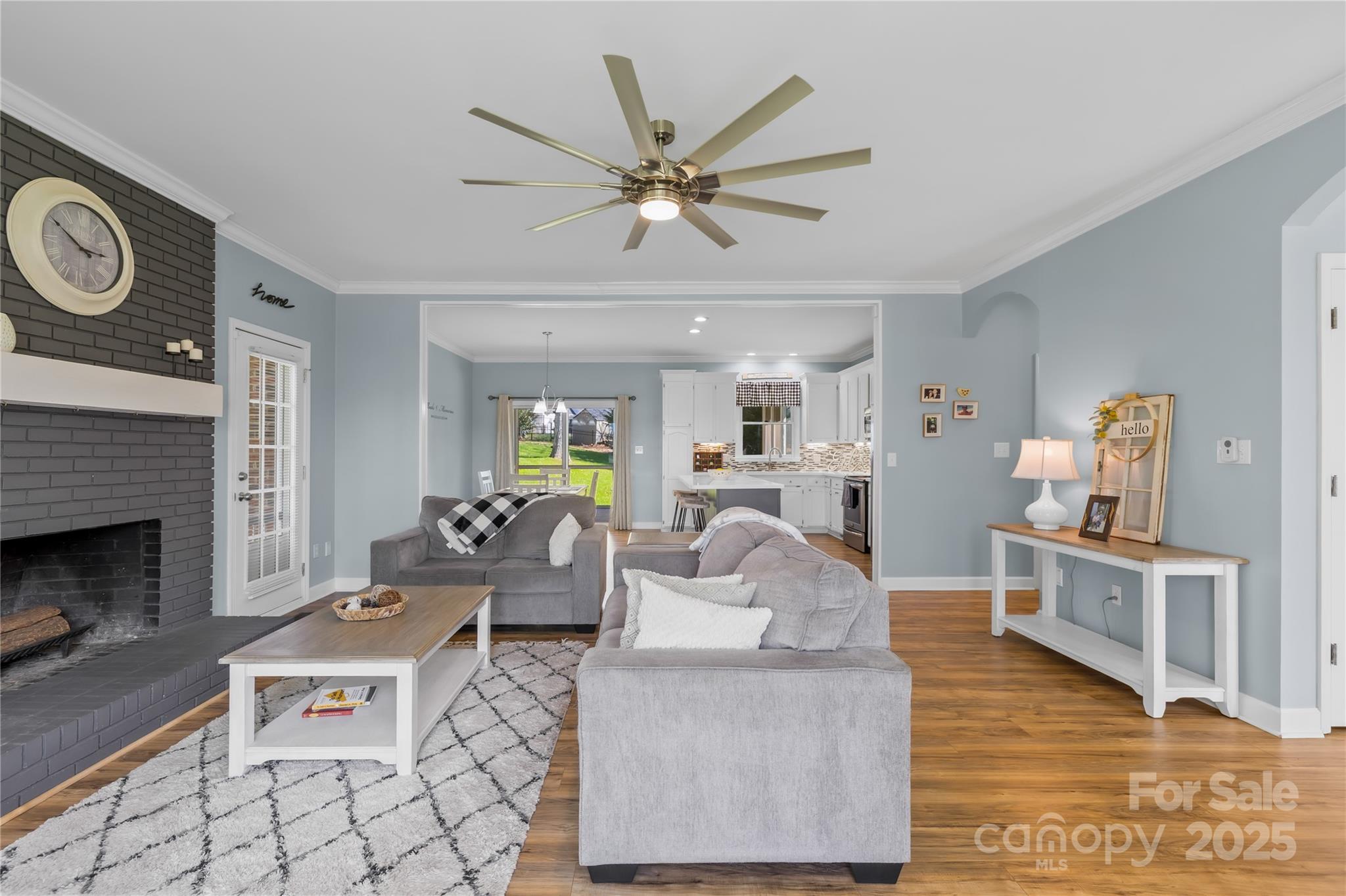 675 Normandy Road Mooresville, NC 28117 - Photo 10 of 36 a living room with furniture and a fireplace