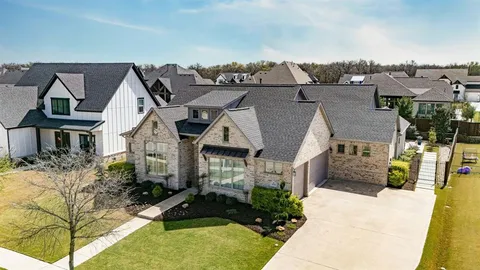 a aerial view of a house with a swimming pool