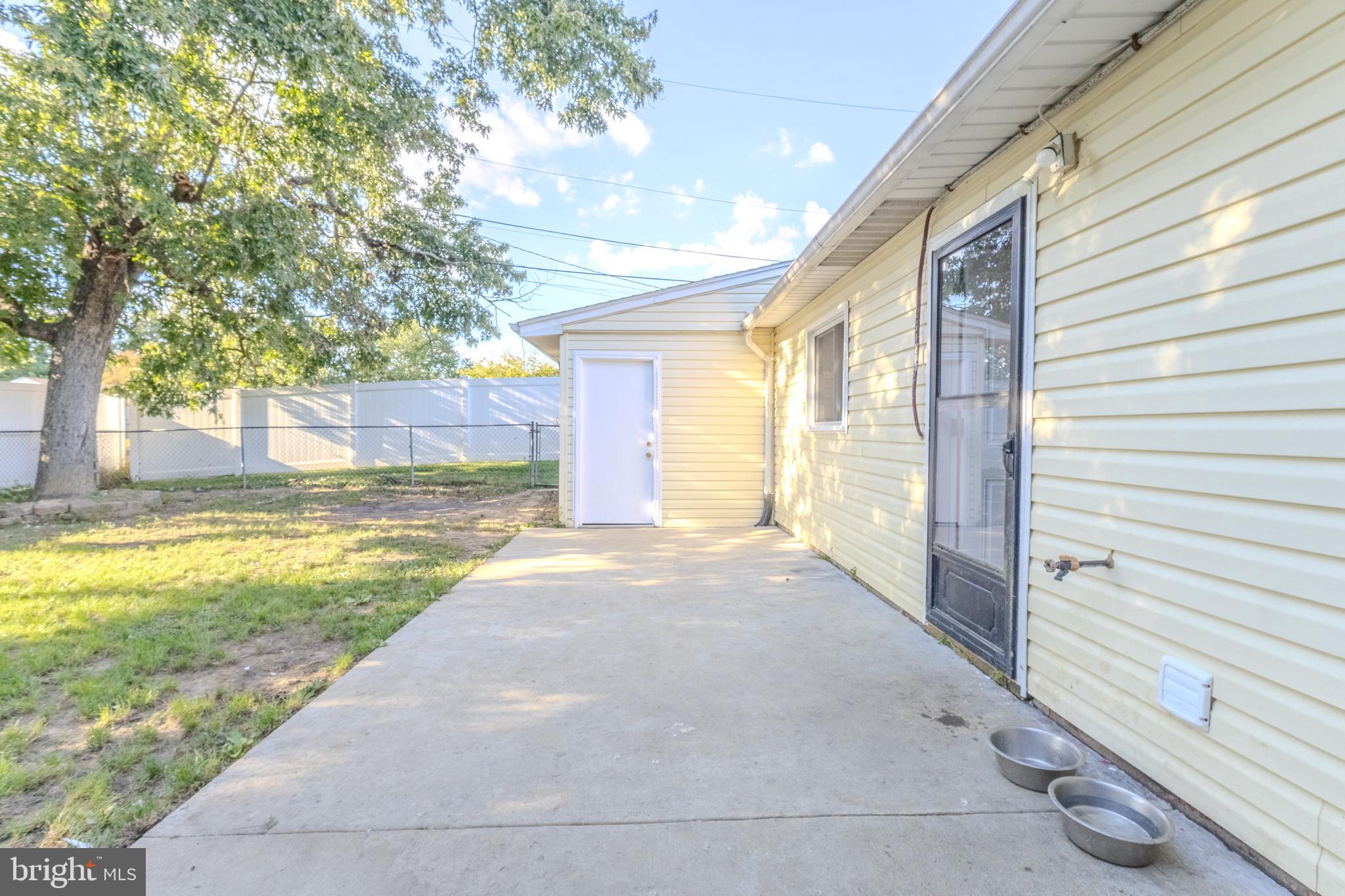 2106 North Rolling Road Windsor Mill, MD 21244 - Photo 22 of 26 a view of an house with backyard and trees