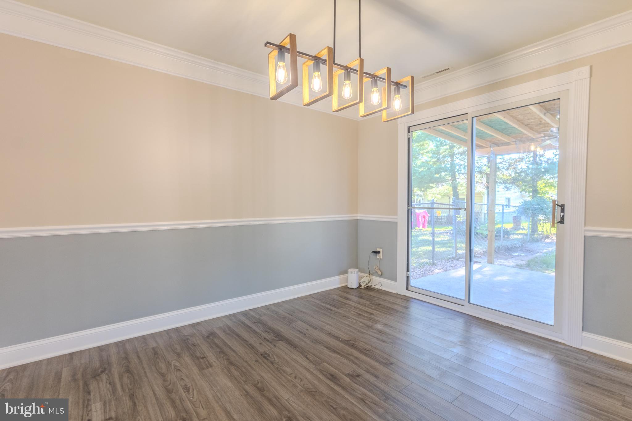 2106 North Rolling Road Windsor Mill, MD 21244 - Photo 9 of 26 a view of empty room with wooden floor and fan