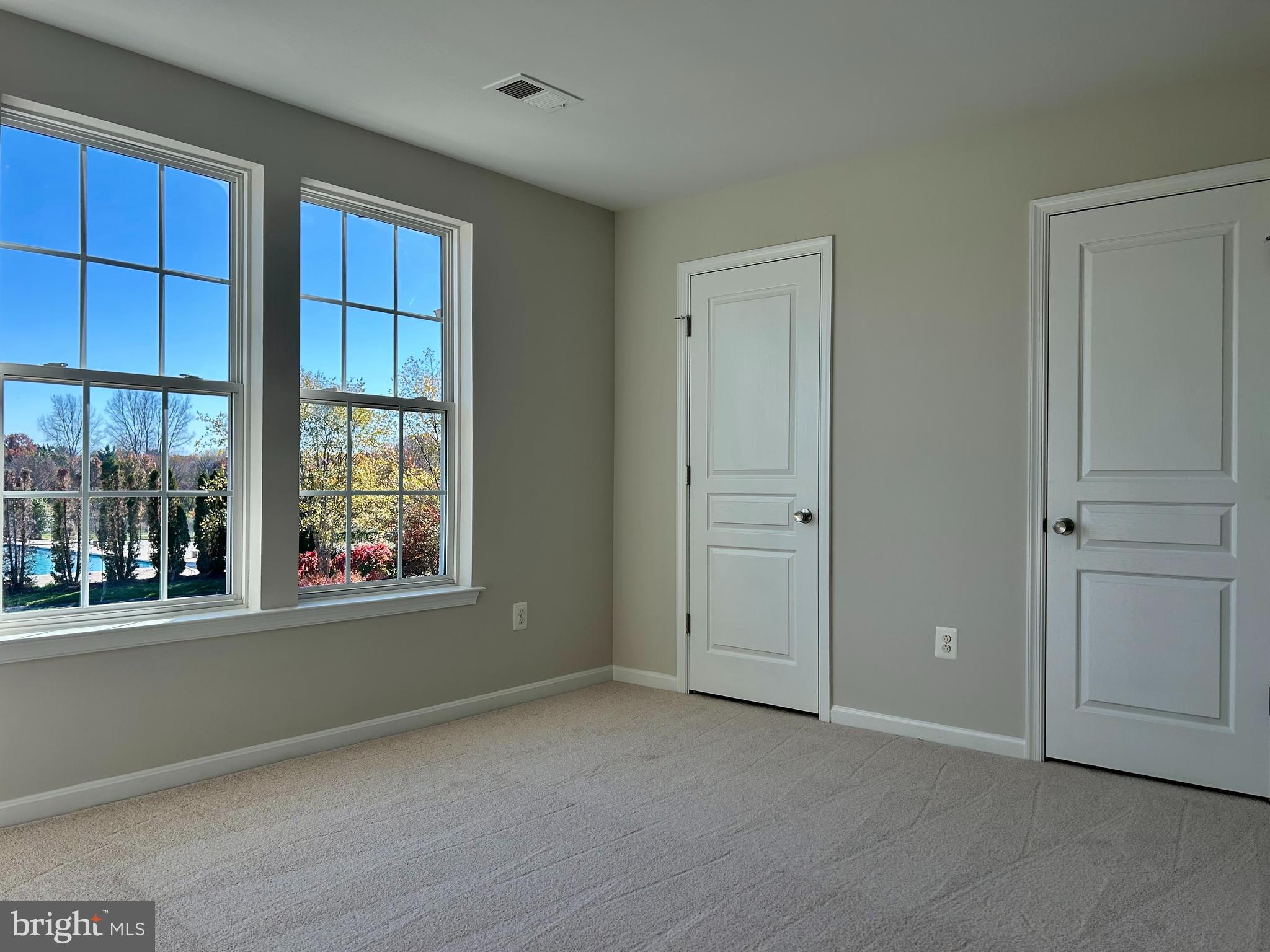1846 Monocacy View Circle, Unit 64A Frederick, MD 21701 - Photo 11 of 13 an empty room with windows and closet
