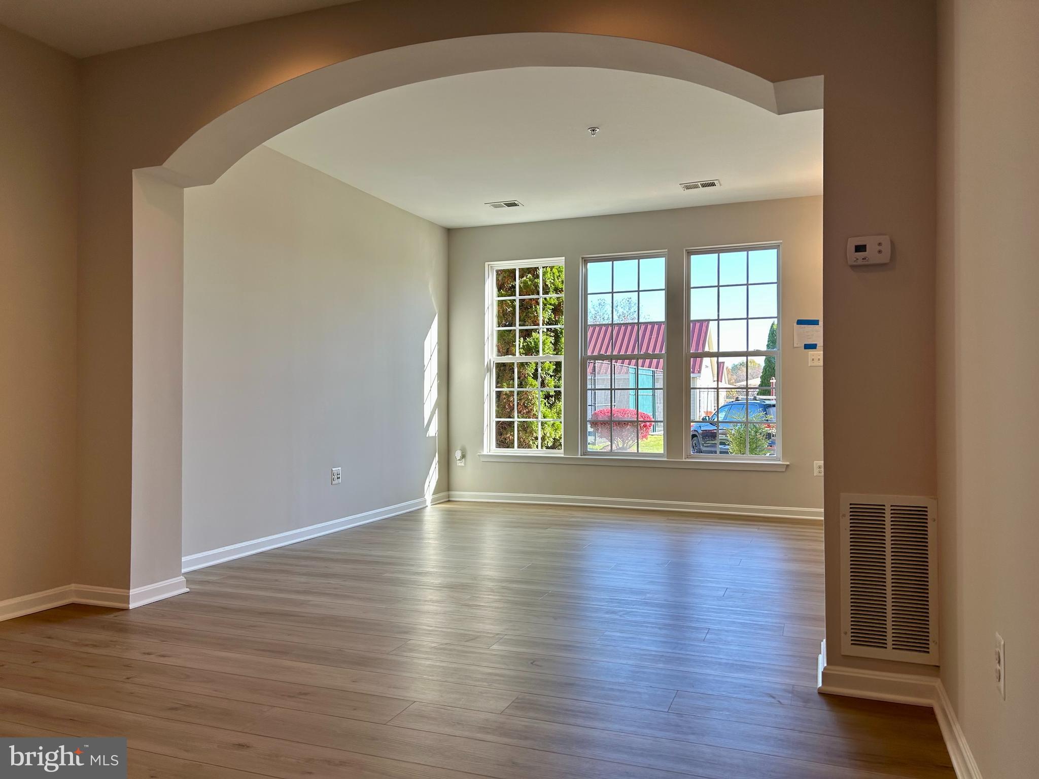1846 Monocacy View Circle, Unit 64A Frederick, MD 21701 - Photo 2 of 13 a view of empty room with wooden floor and fan