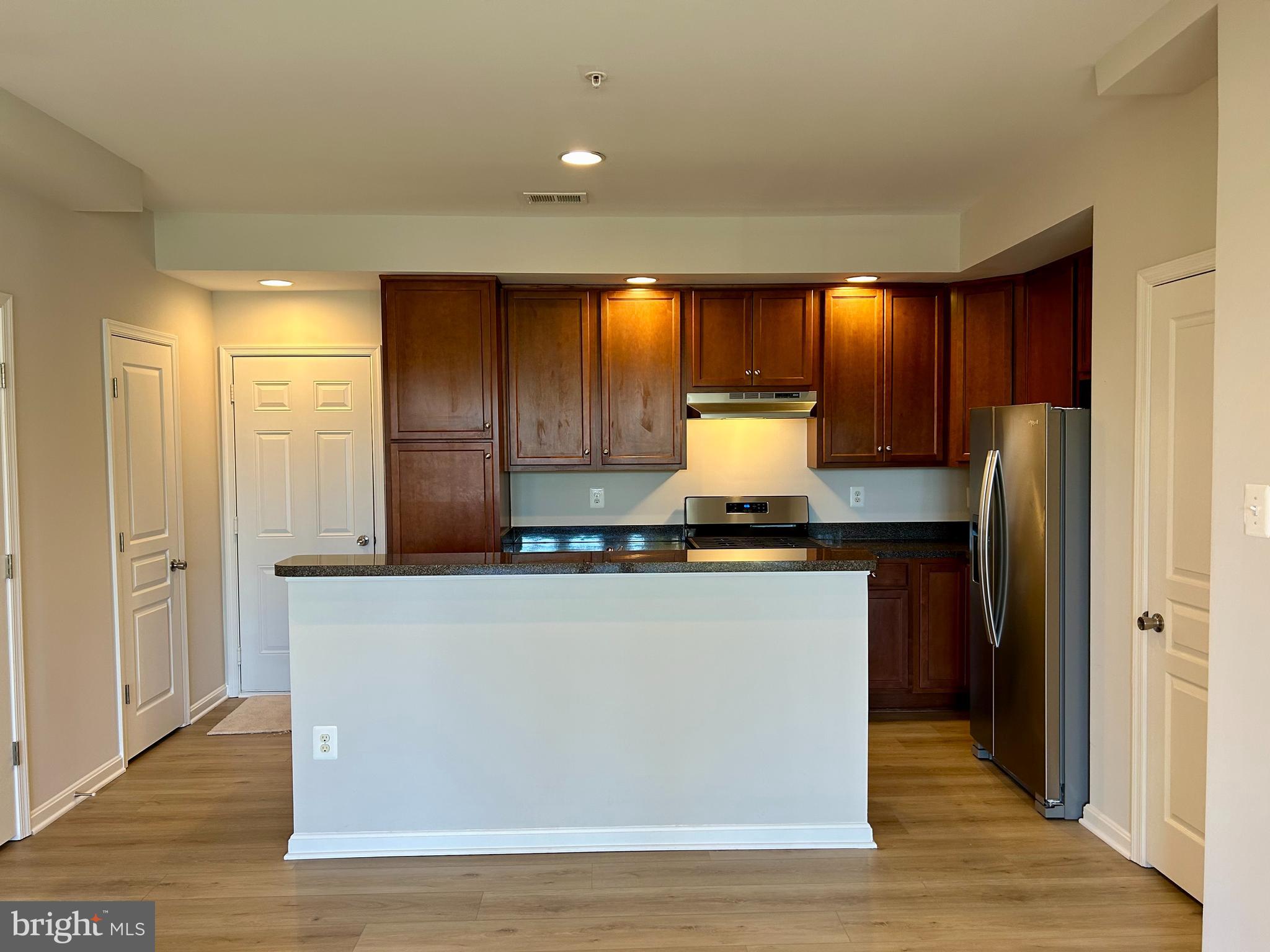 1846 Monocacy View Circle, Unit 64A Frederick, MD 21701 - Photo 3 of 13 a kitchen with stainless steel appliances granite countertop a refrigerator and a stove top oven
