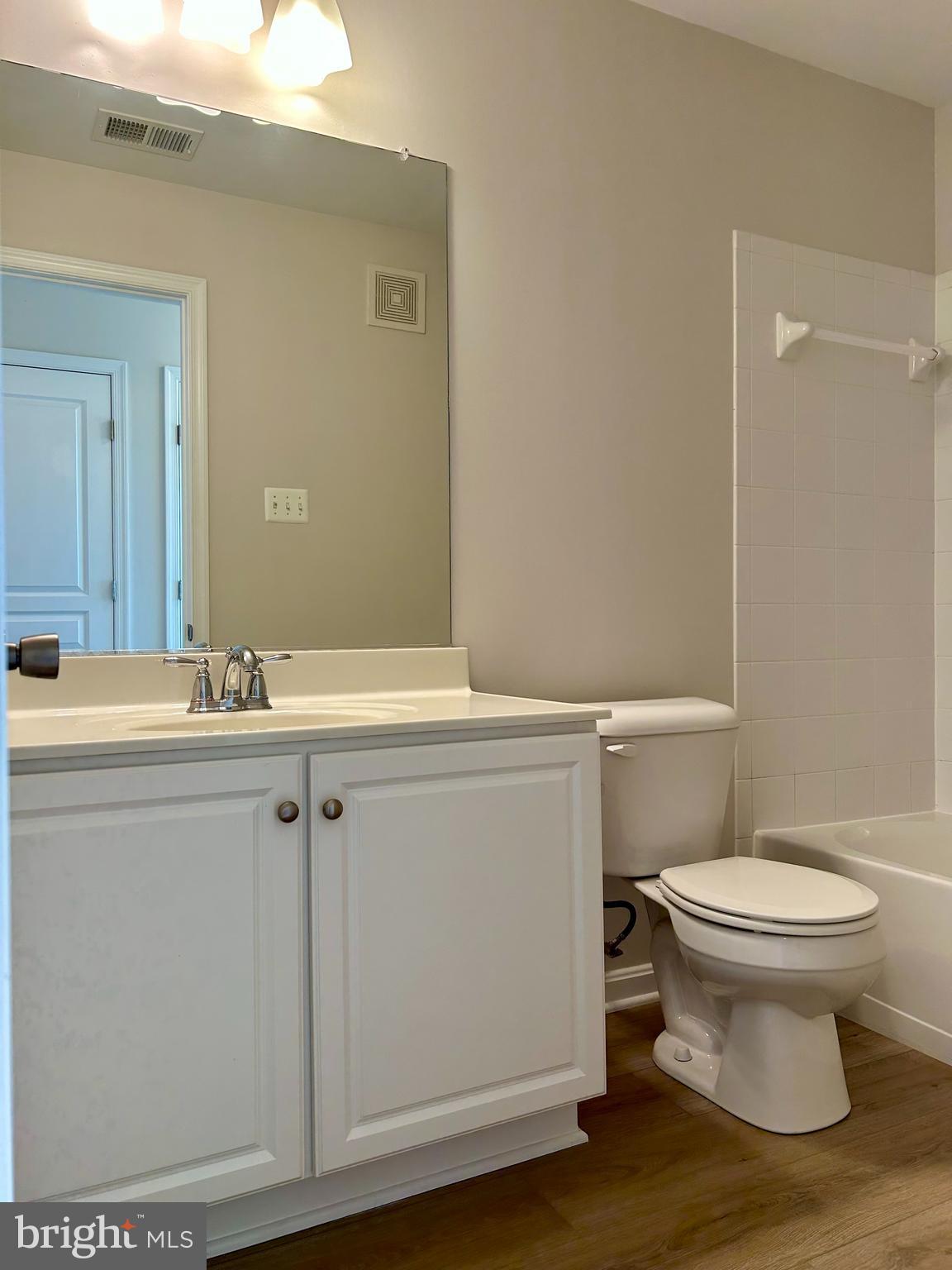 1846 Monocacy View Circle, Unit 64A Frederick, MD 21701 - Photo 7 of 13 a bathroom with a sink toilet and vanity