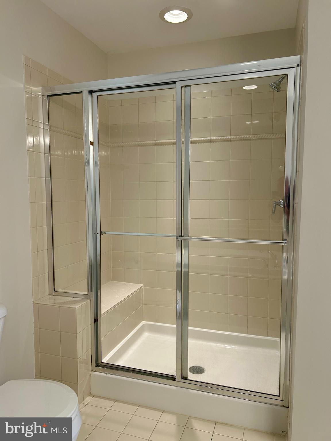 1846 Monocacy View Circle, Unit 64A Frederick, MD 21701 - Photo 10 of 13 a bathroom with a glass shower door