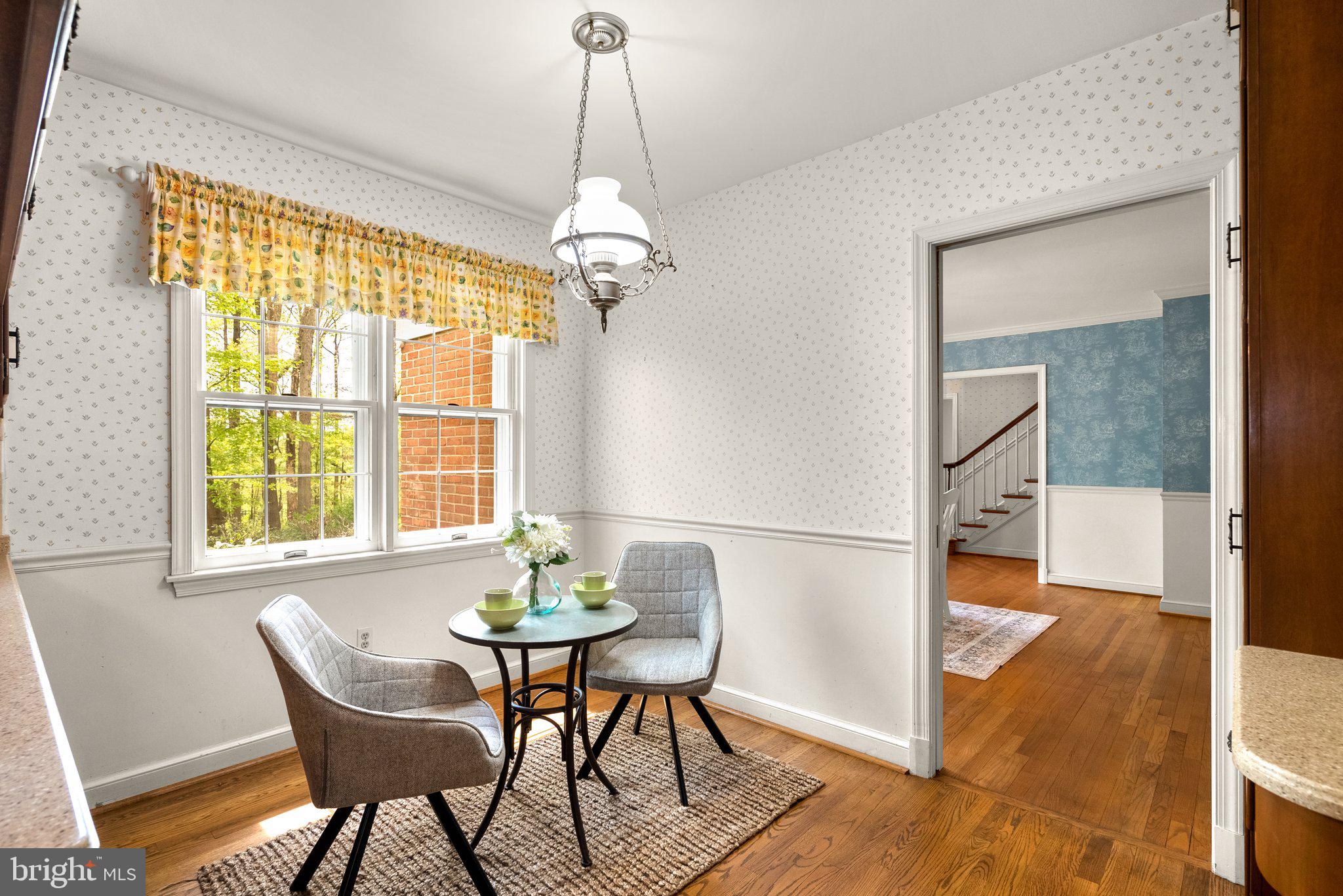4811 Olney Laytonsville Road Olney, MD 20832 - Photo 14 of 63 a view of a dining room with furniture window and wooden floor