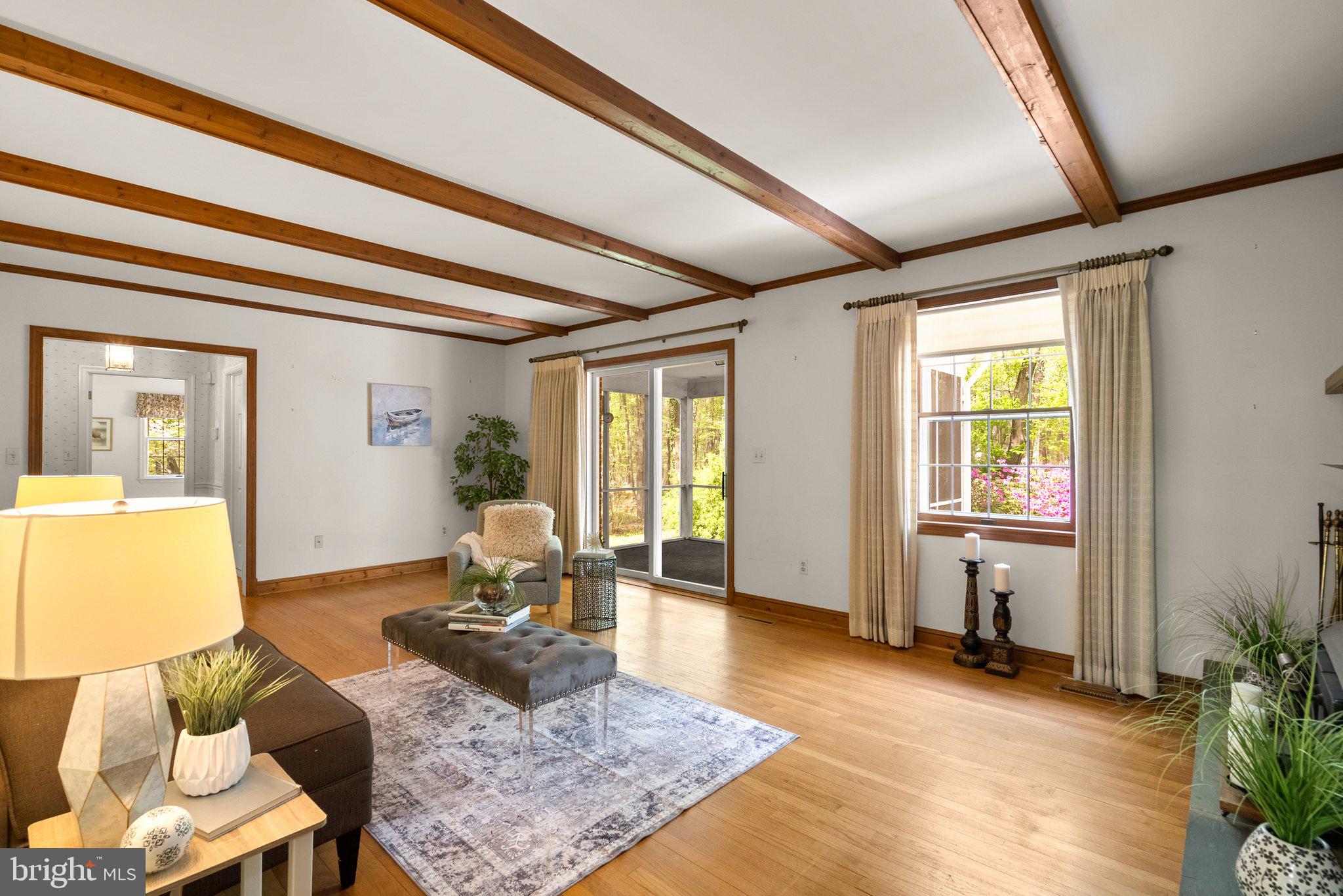 4811 Olney Laytonsville Road Olney, MD 20832 - Photo 16 of 63 a living room with furniture and a window