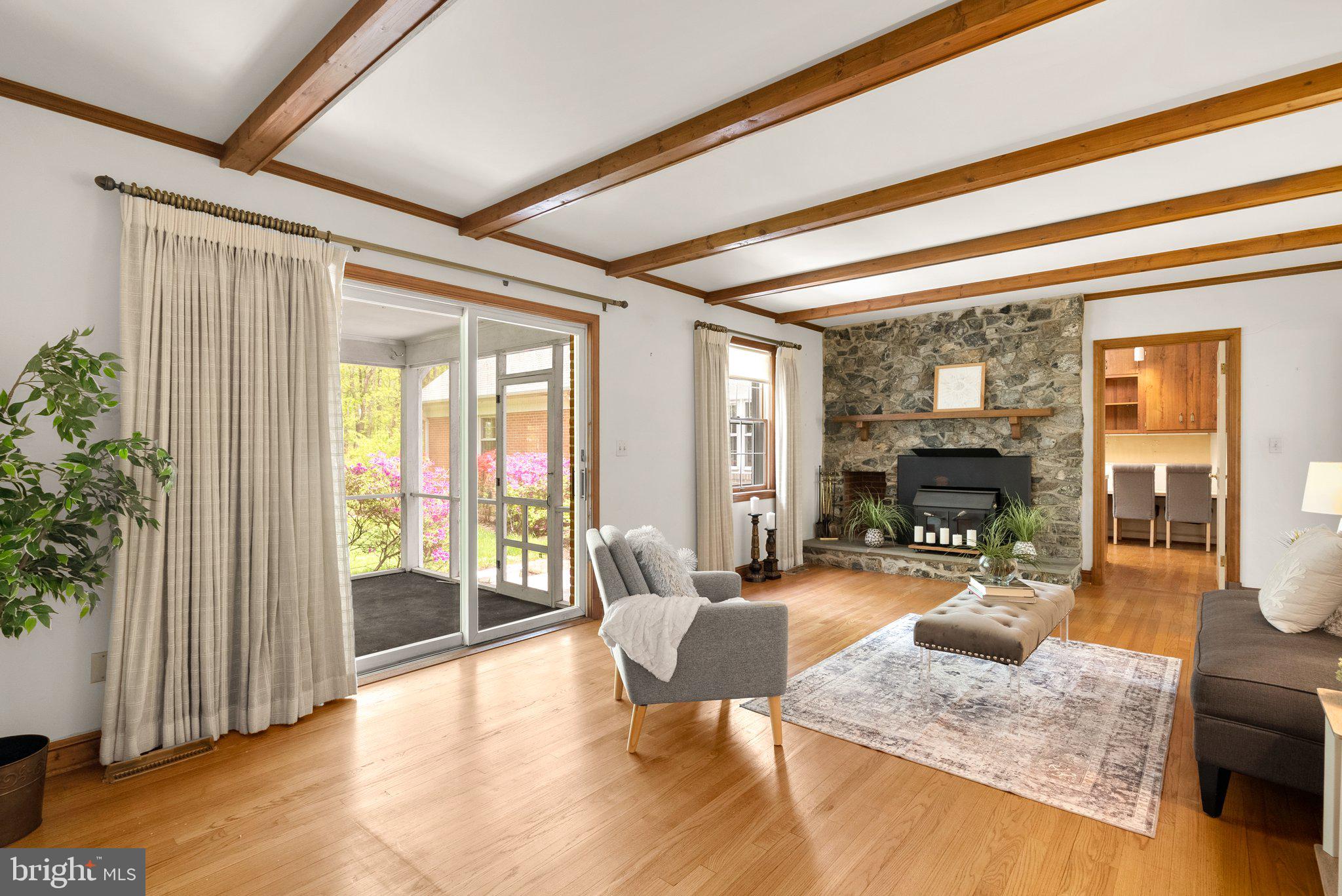 4811 Olney Laytonsville Road Olney, MD 20832 - Photo 17 of 63 a living room with furniture and a large window