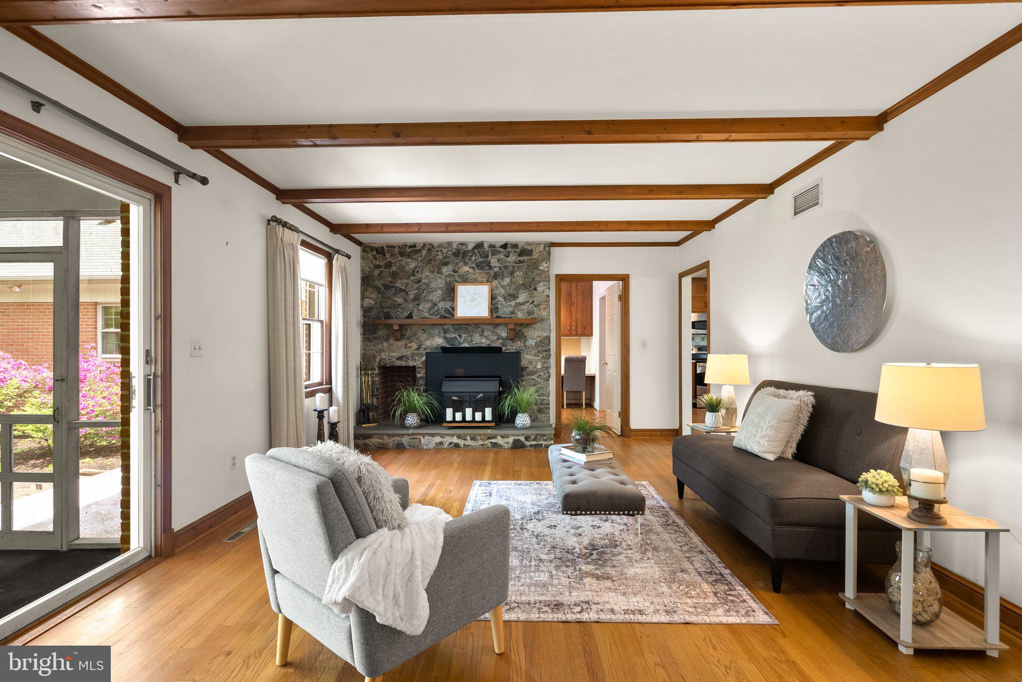 4811 Olney Laytonsville Road Olney, MD 20832 - Photo 18 of 63 a living room with furniture and a large window