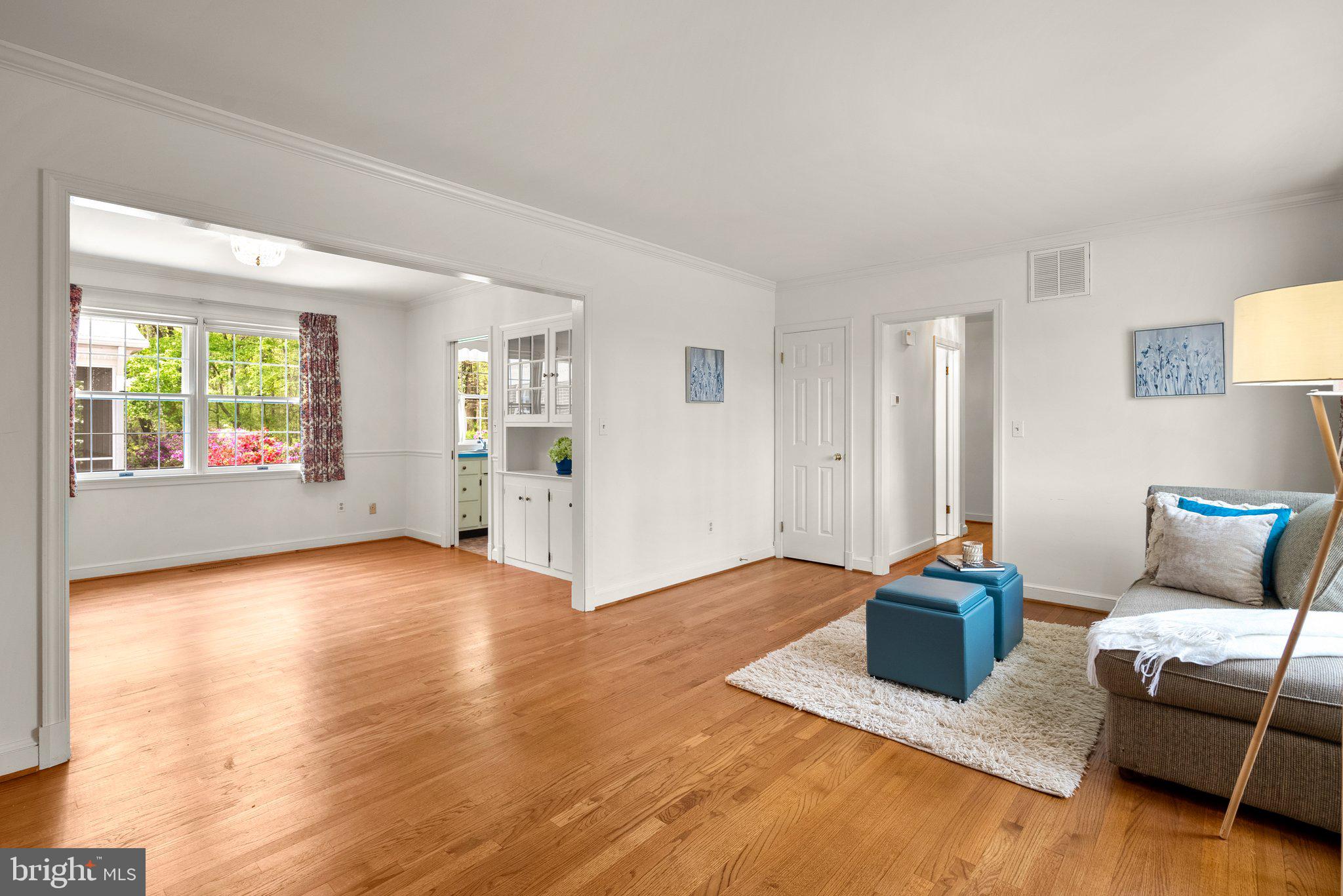 4811 Olney Laytonsville Road Olney, MD 20832 - Photo 23 of 63 a living room with furniture and a wooden floor