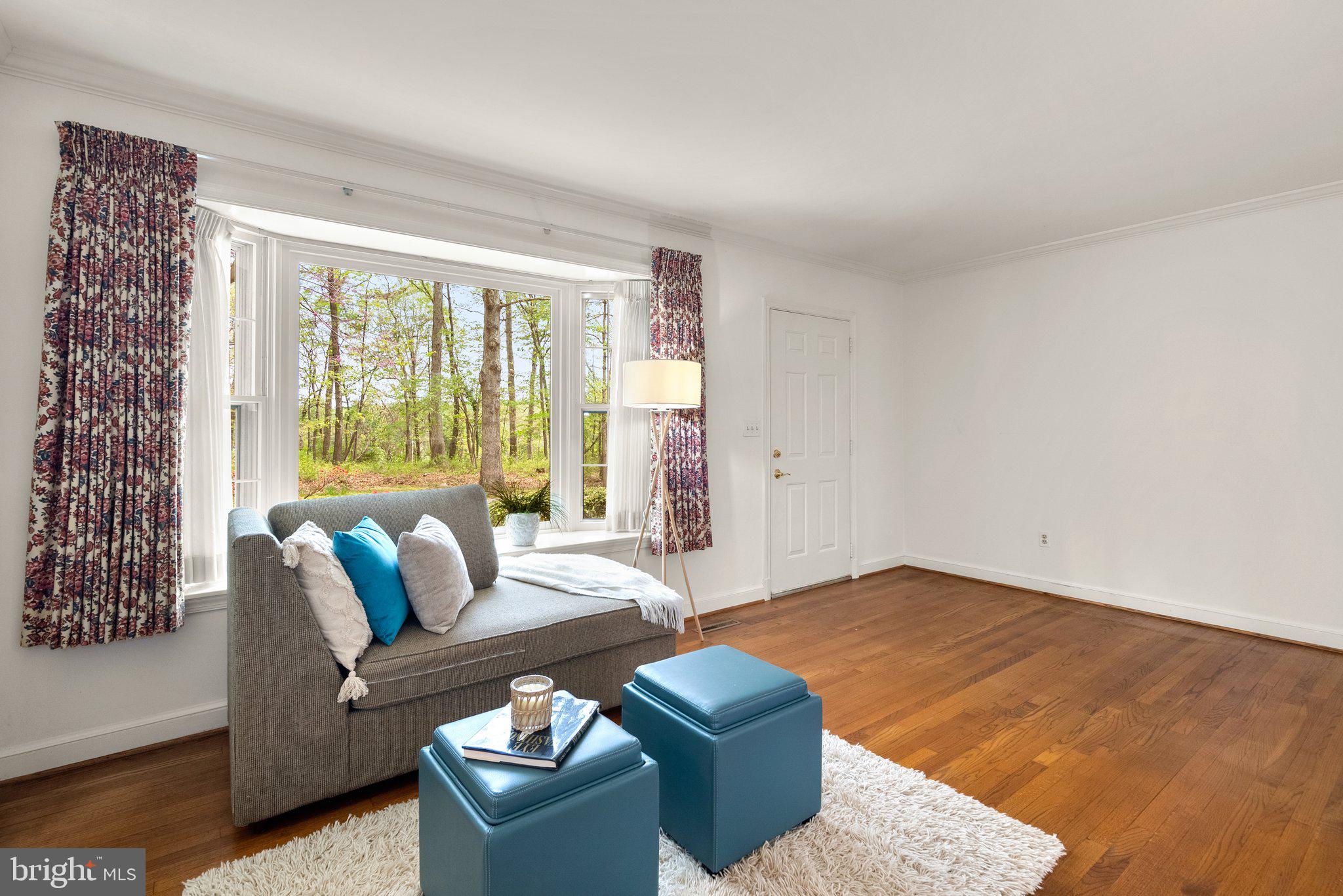 4811 Olney Laytonsville Road Olney, MD 20832 - Photo 24 of 63 a living room with furniture and a large window