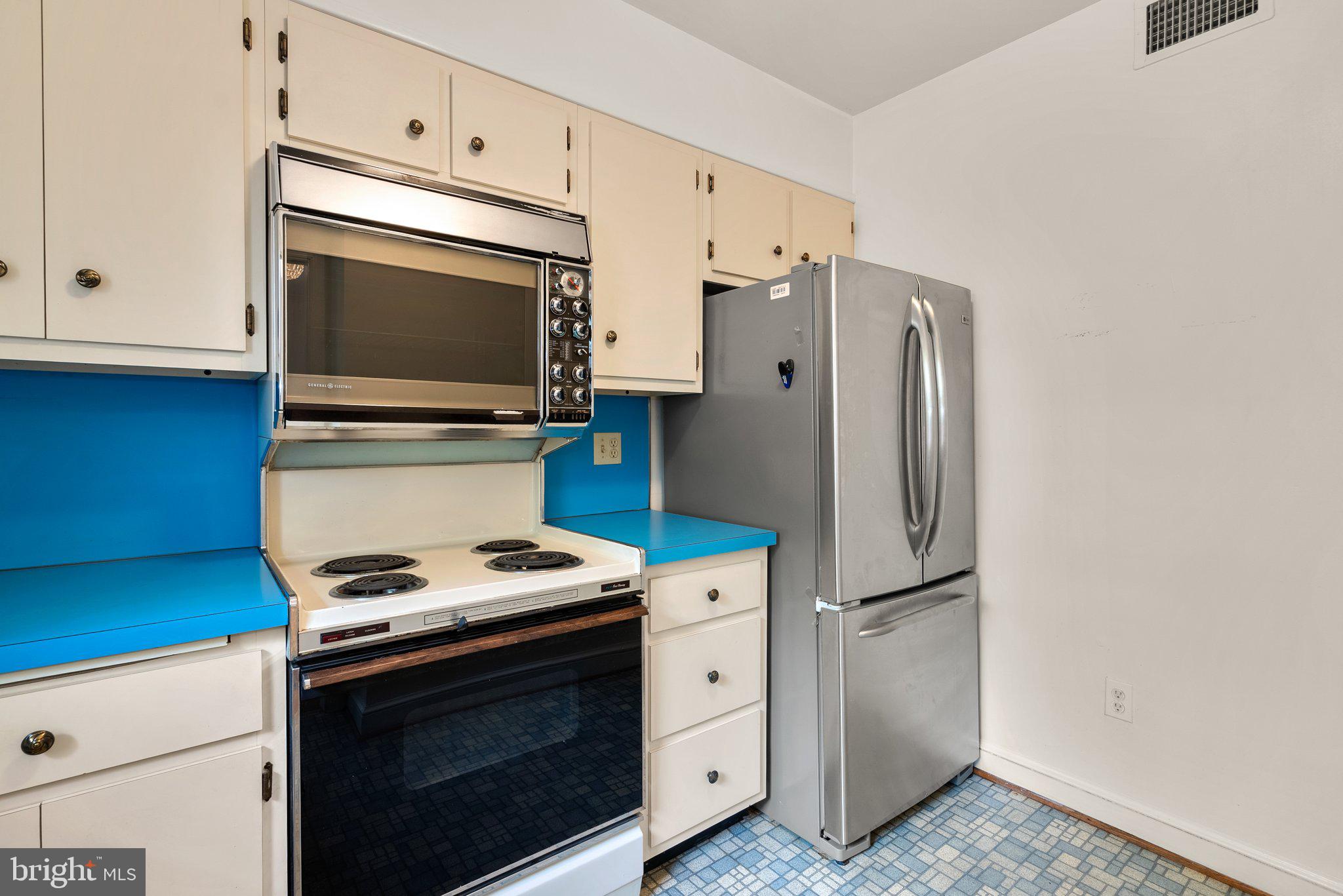 4811 Olney Laytonsville Road Olney, MD 20832 - Photo 26 of 63 a kitchen with cabinets and steel stainless steel appliances