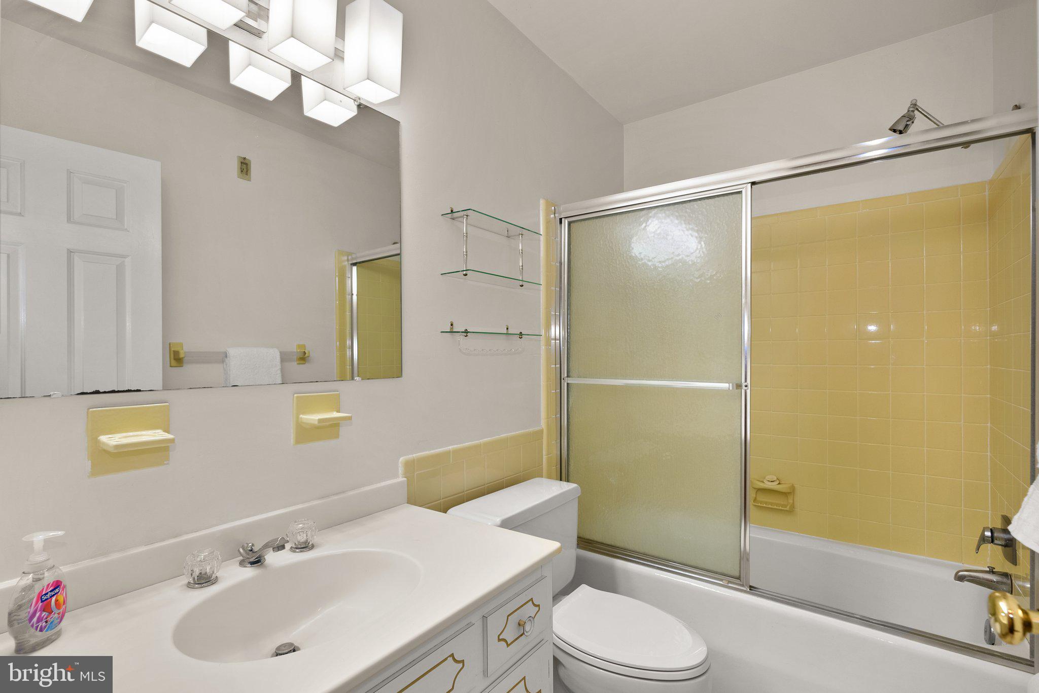 4811 Olney Laytonsville Road Olney, MD 20832 - Photo 28 of 63 a bathroom with a sink a toilet and shower