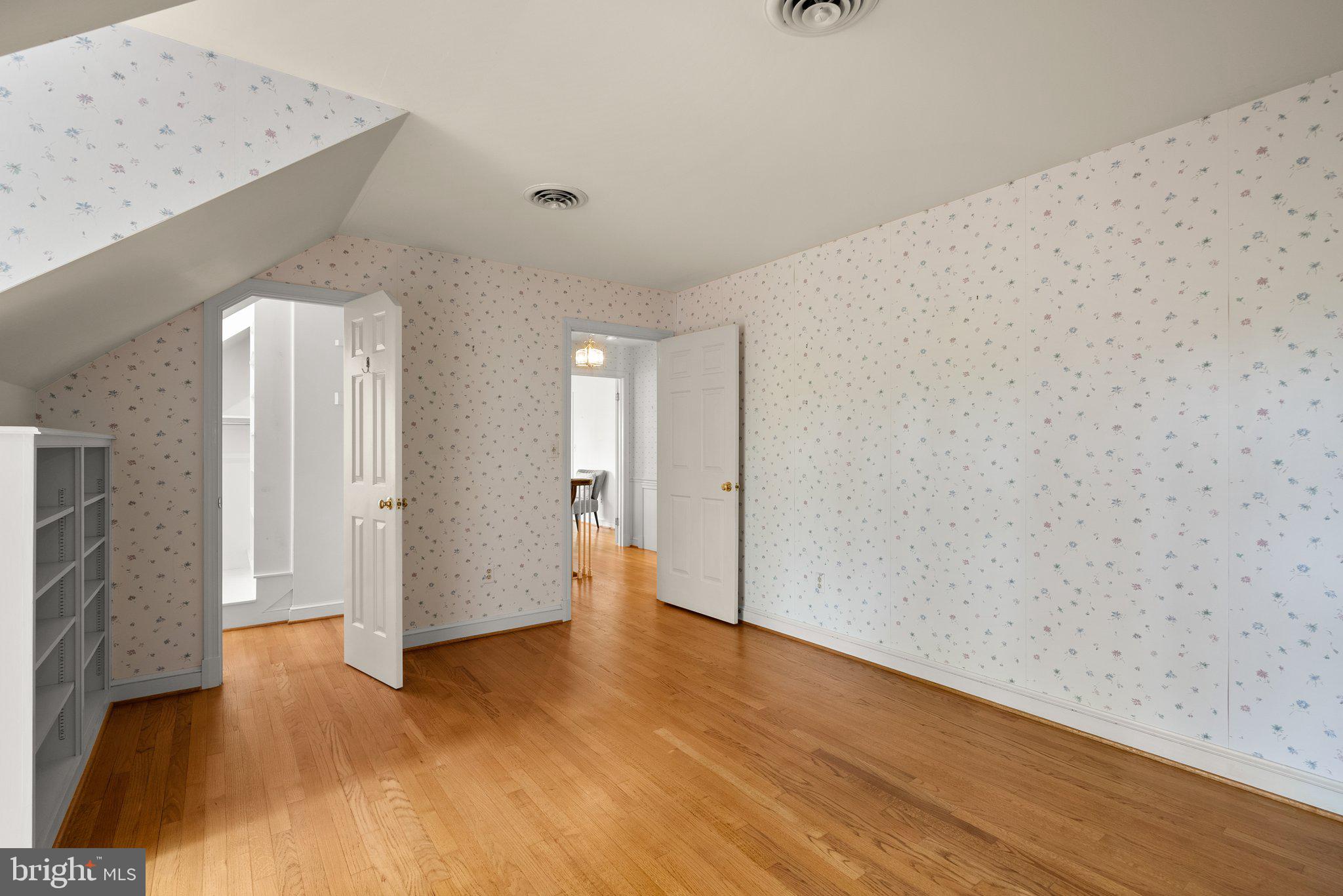 4811 Olney Laytonsville Road Olney, MD 20832 - Photo 40 of 63 a view of an empty room with wooden floor and a window