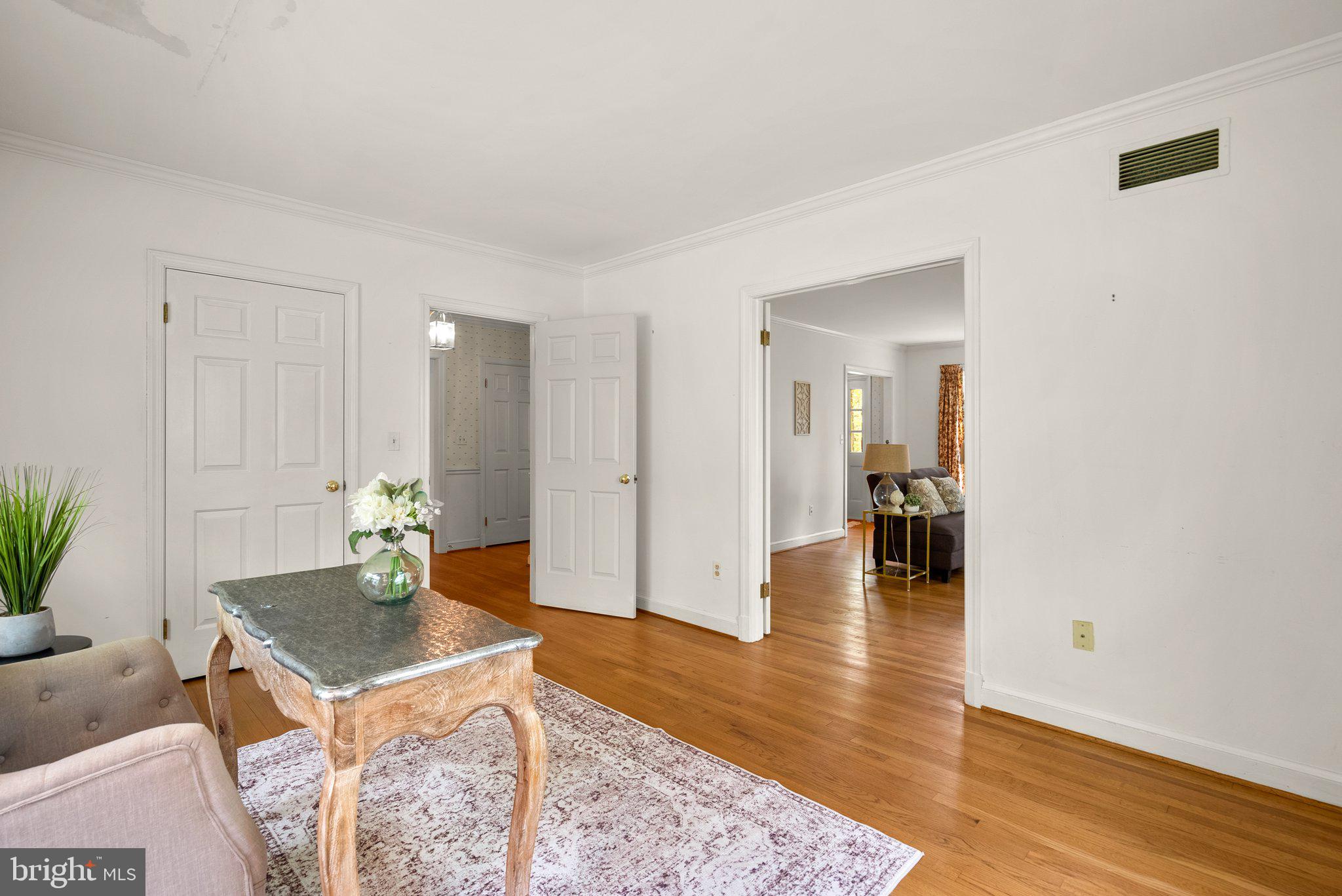 4811 Olney Laytonsville Road Olney, MD 20832 - Photo 7 of 63 a room with a table and chairs