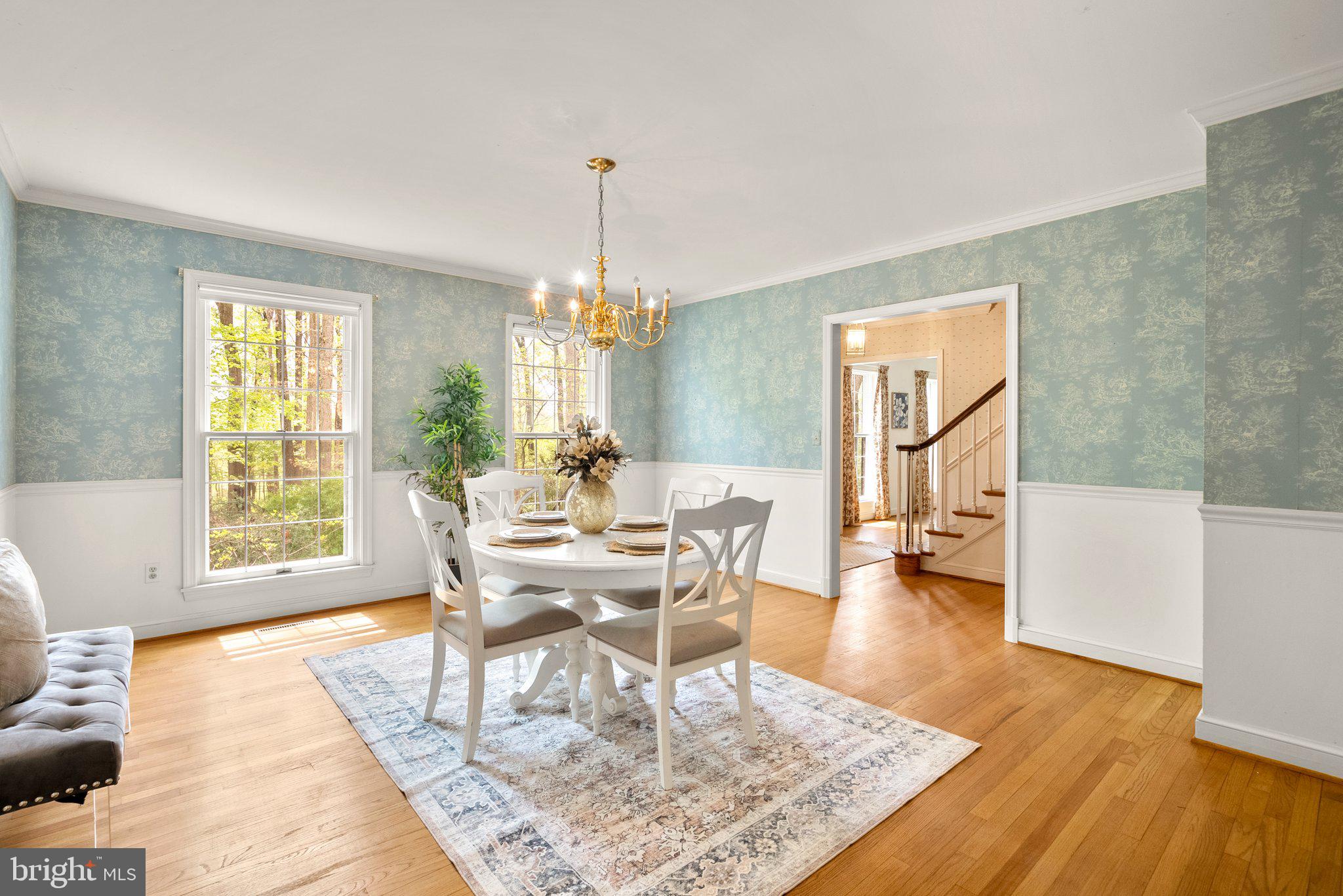 4811 Olney Laytonsville Road Olney, MD 20832 - Photo 10 of 63 a view of a dining room with furniture window and wooden floor