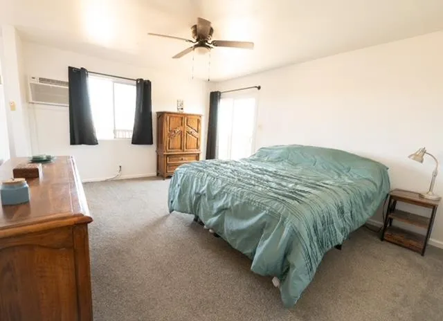 a bed sitting in a room next to a window