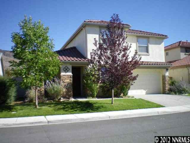 10740 Copper Lake Drive Reno, NV 89521 - Photo 1 of 1 a front view of a house with a garden and trees