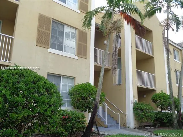 a view of a house with a tree