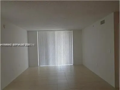 a view of a livingroom and entryway